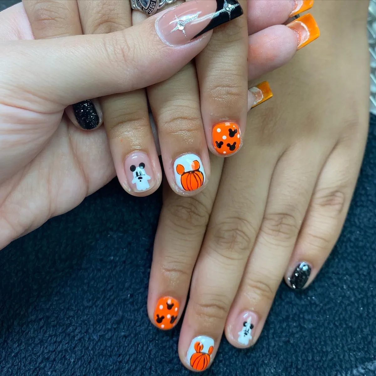 Orange bats, white pumpkin motif, and tiny ghost accents