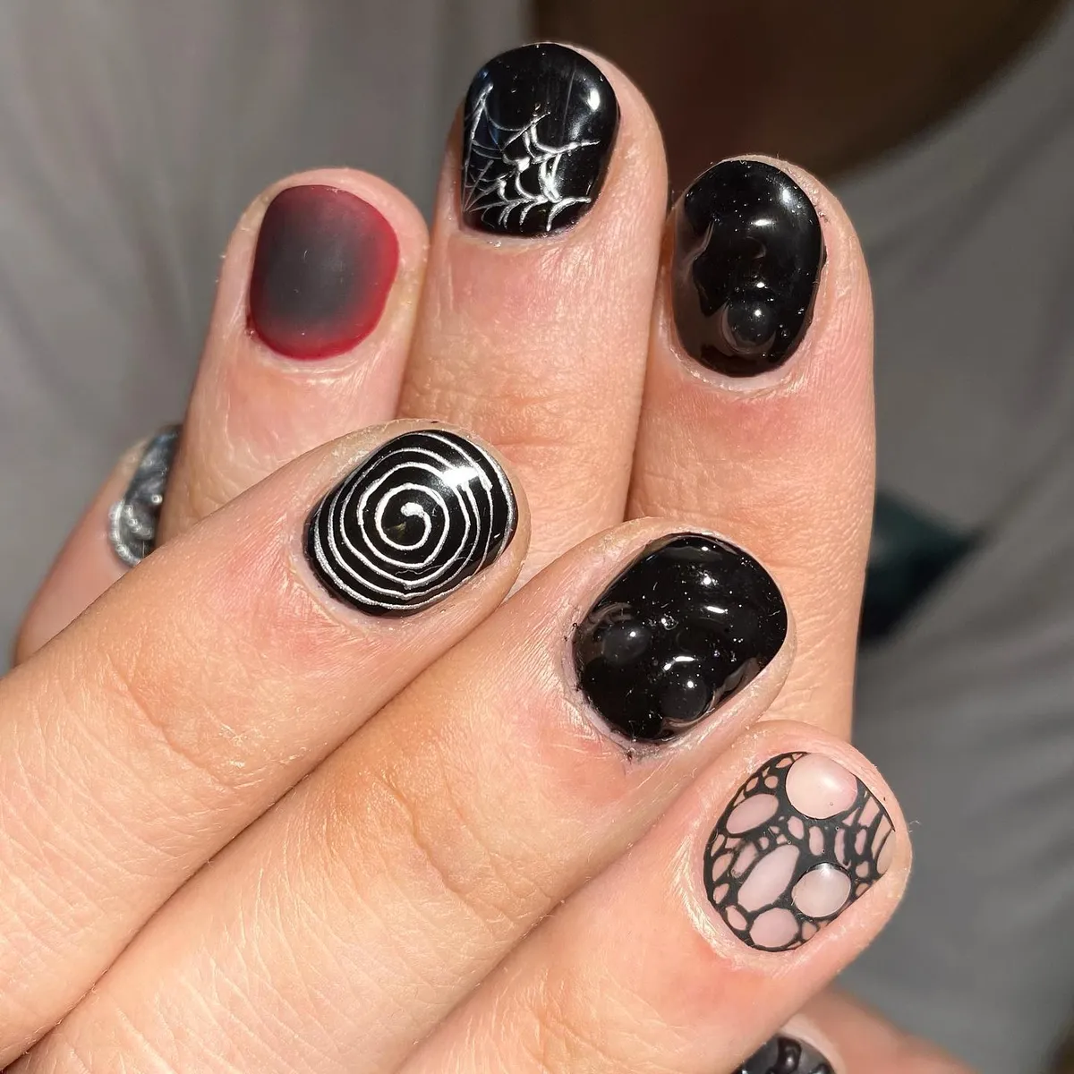 Black glossy set with spiderweb, spiral, and red-to-black gradient