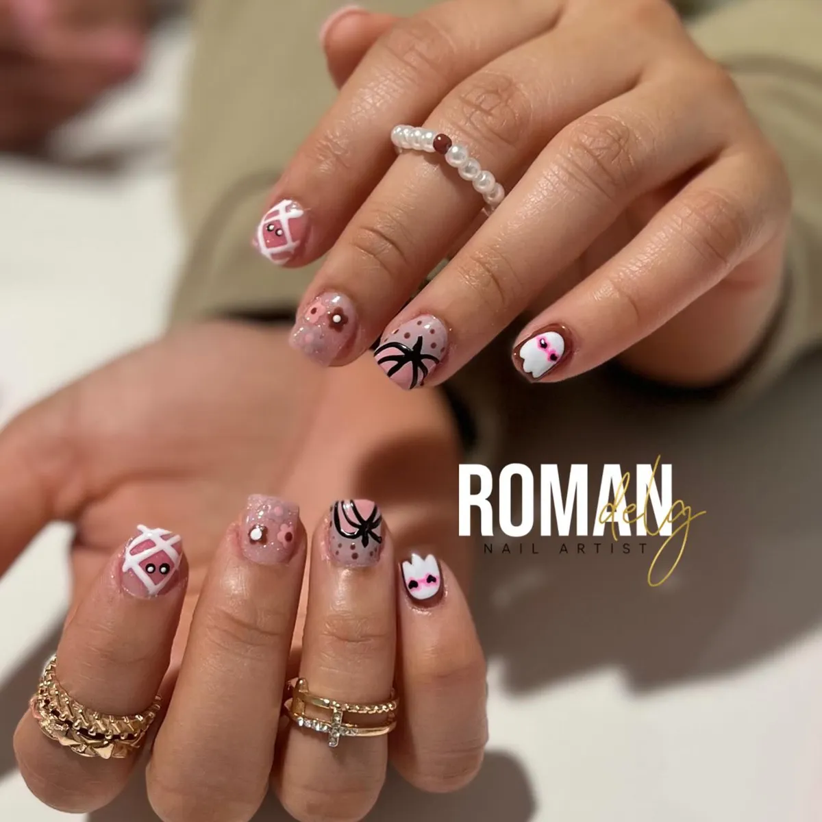 Neutral-pink set with web line art and small ghost accents