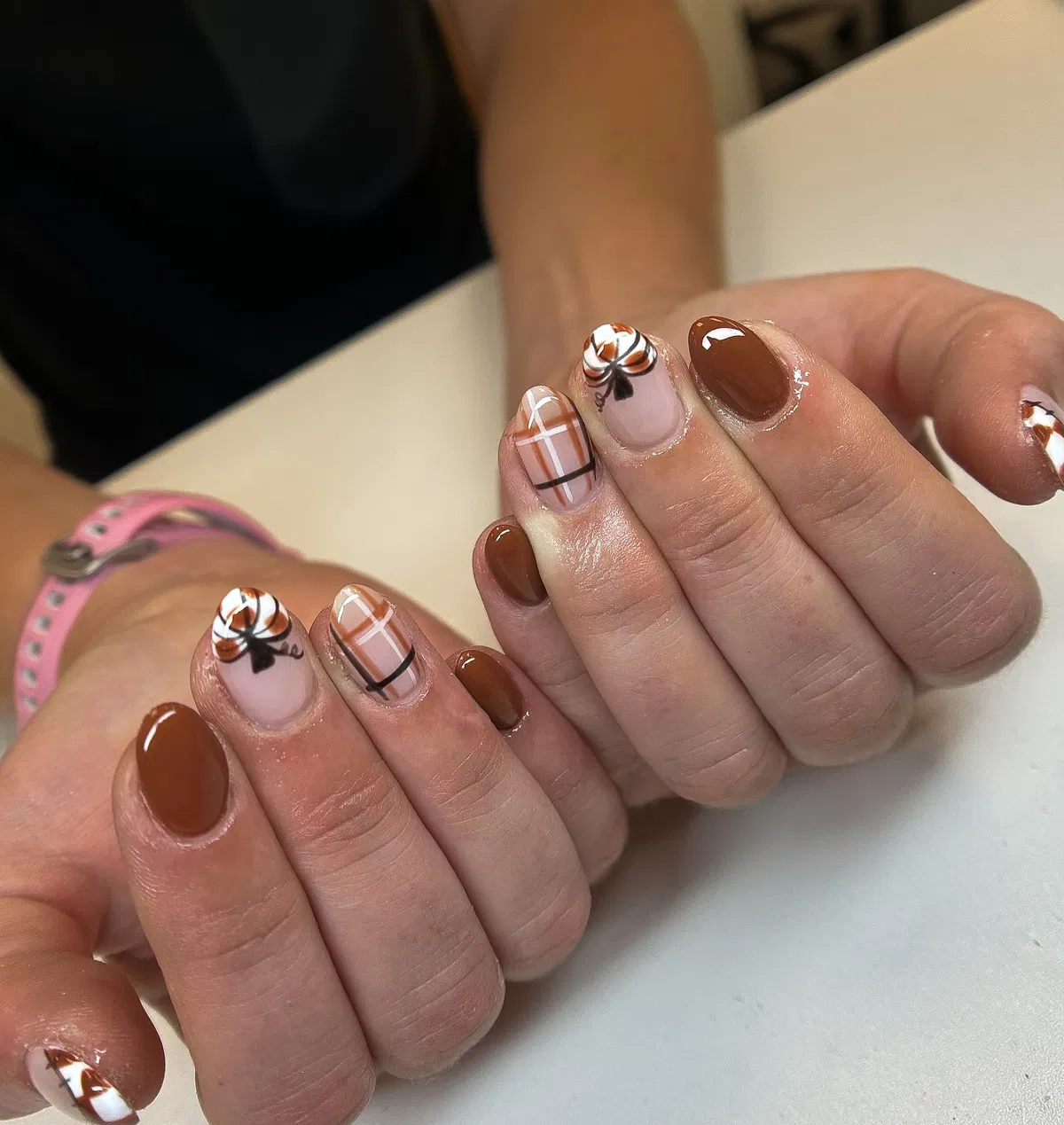 Warm brown gloss with plaid and swirled bow accents