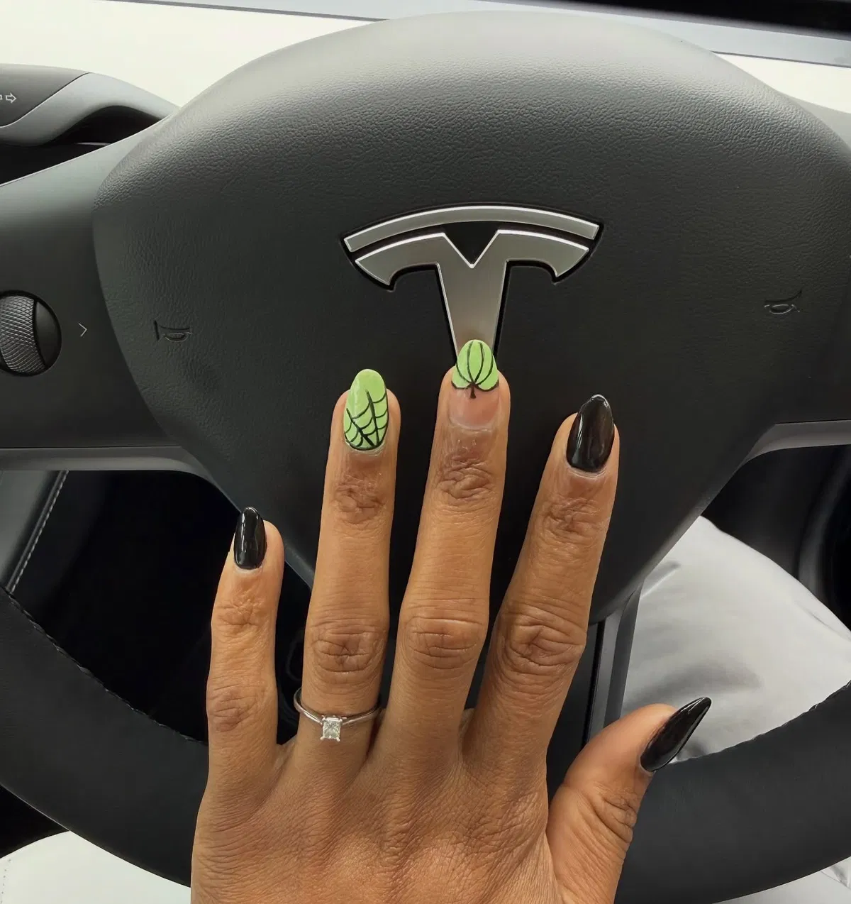 Black nails with green spiderweb accents
