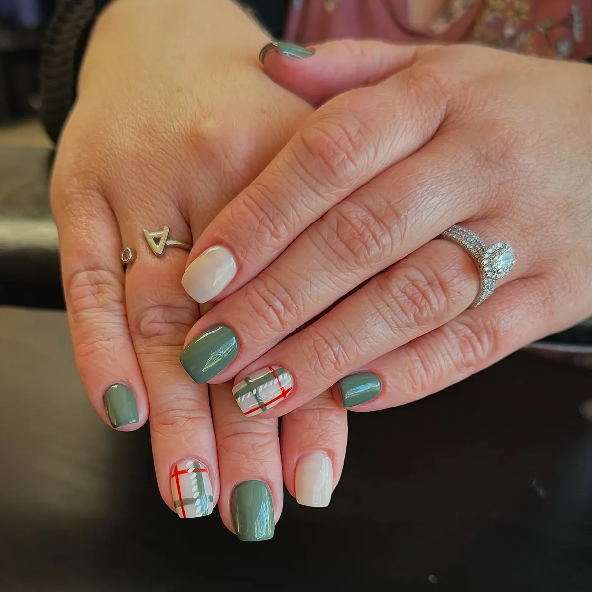 Muted green and off-white with red-and-green plaid accents
