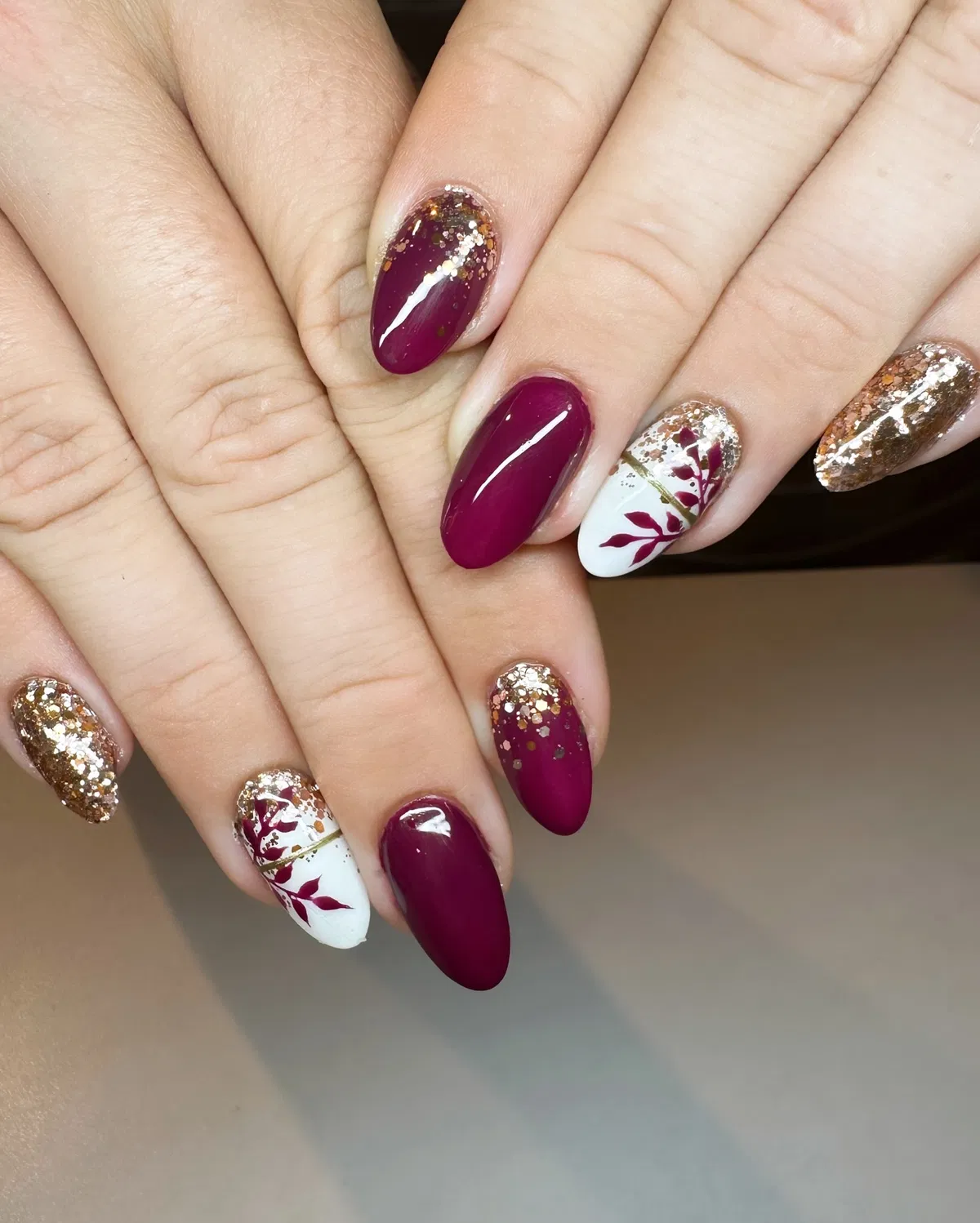 Burgundy and Gold Glitter with Leaf Silhouettes