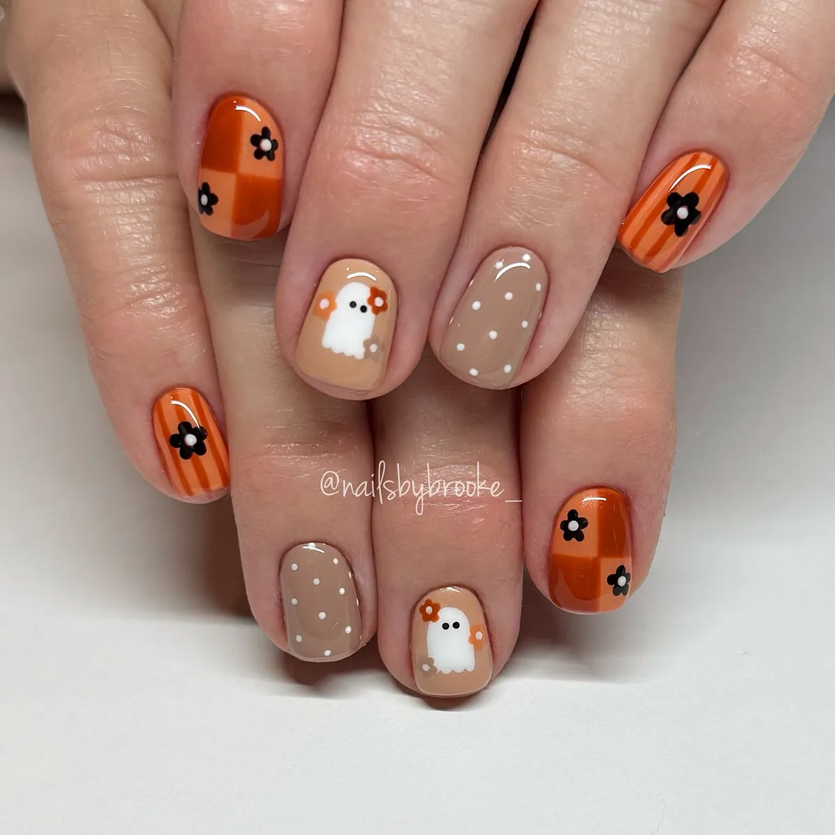 Orange patterns with flowers and a small ghost accent