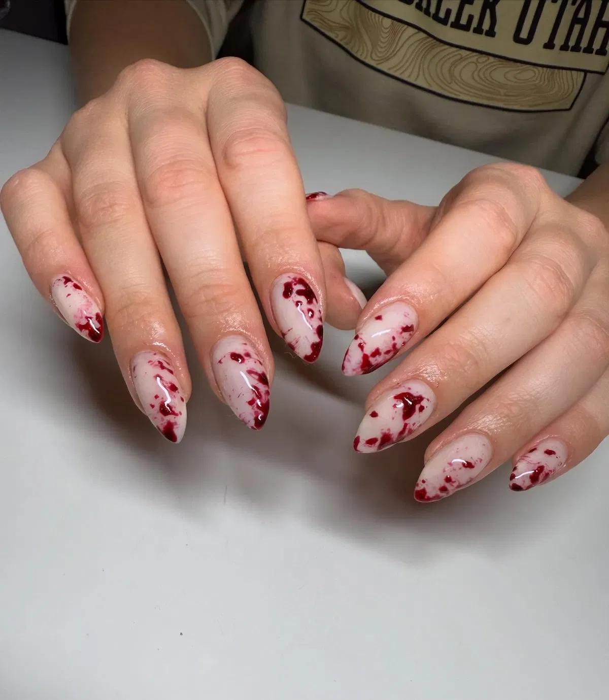 Pale base with dark red splatter effect