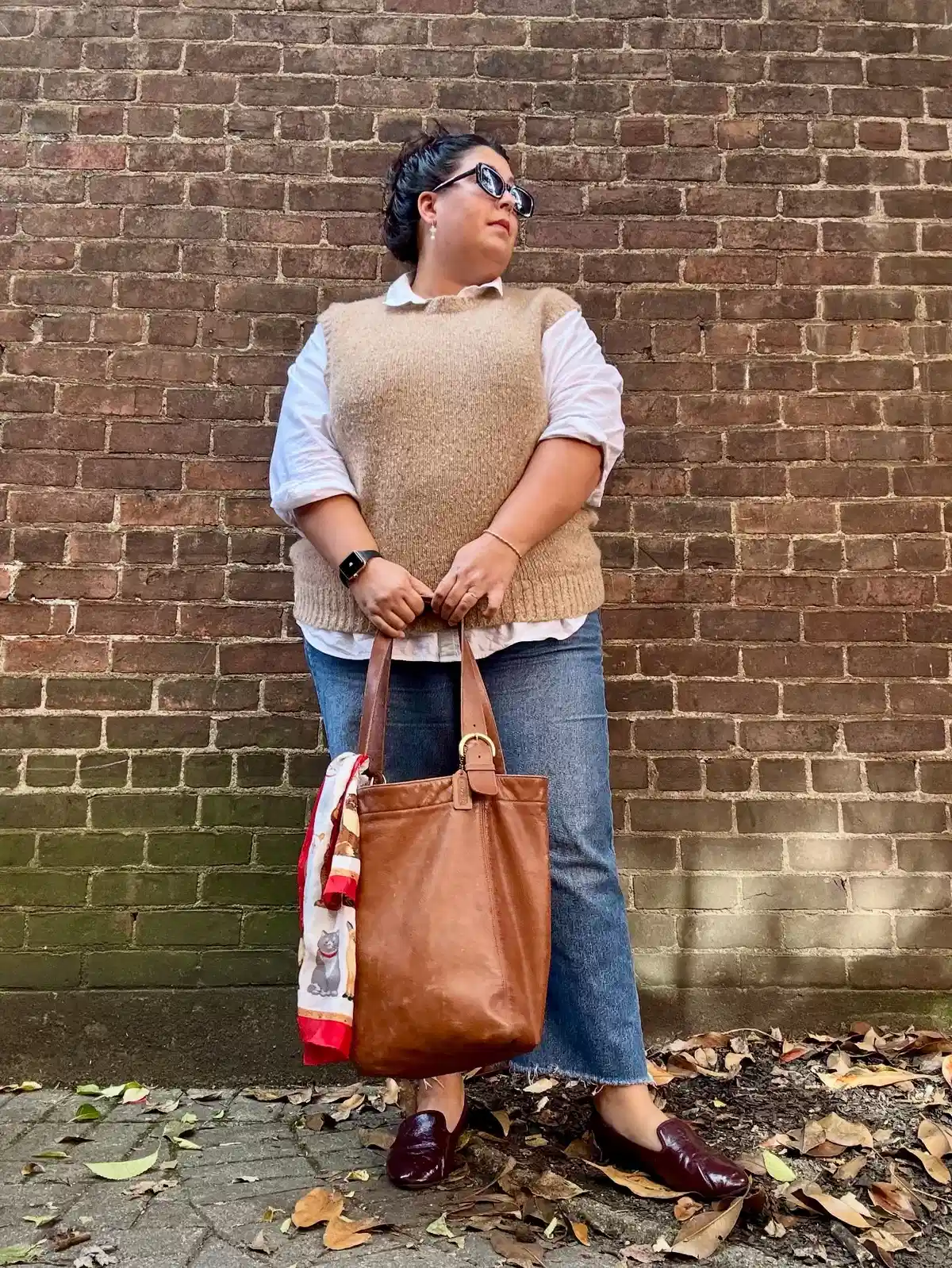 Sweater Vest Layering with Jeans and a Large Tote