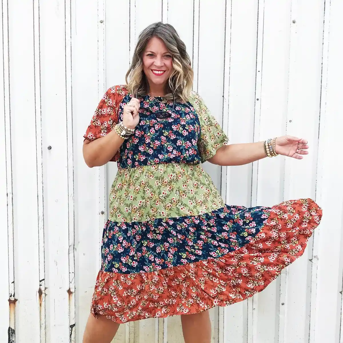Mixed-print floral dress in navy, green, and rust