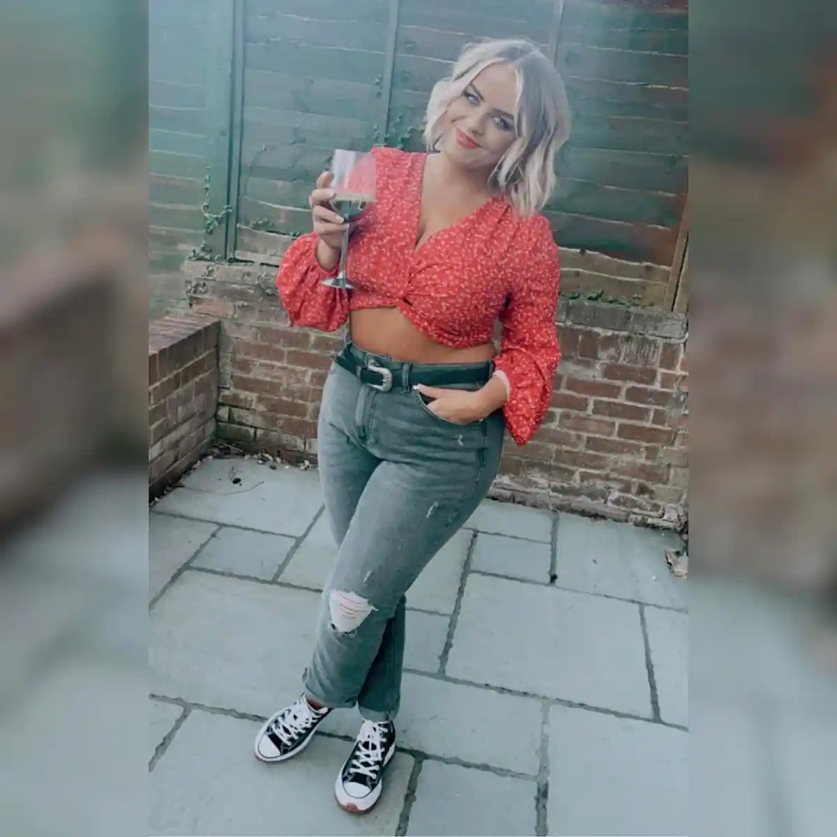 Red printed crop blouse with ripped gray jeans