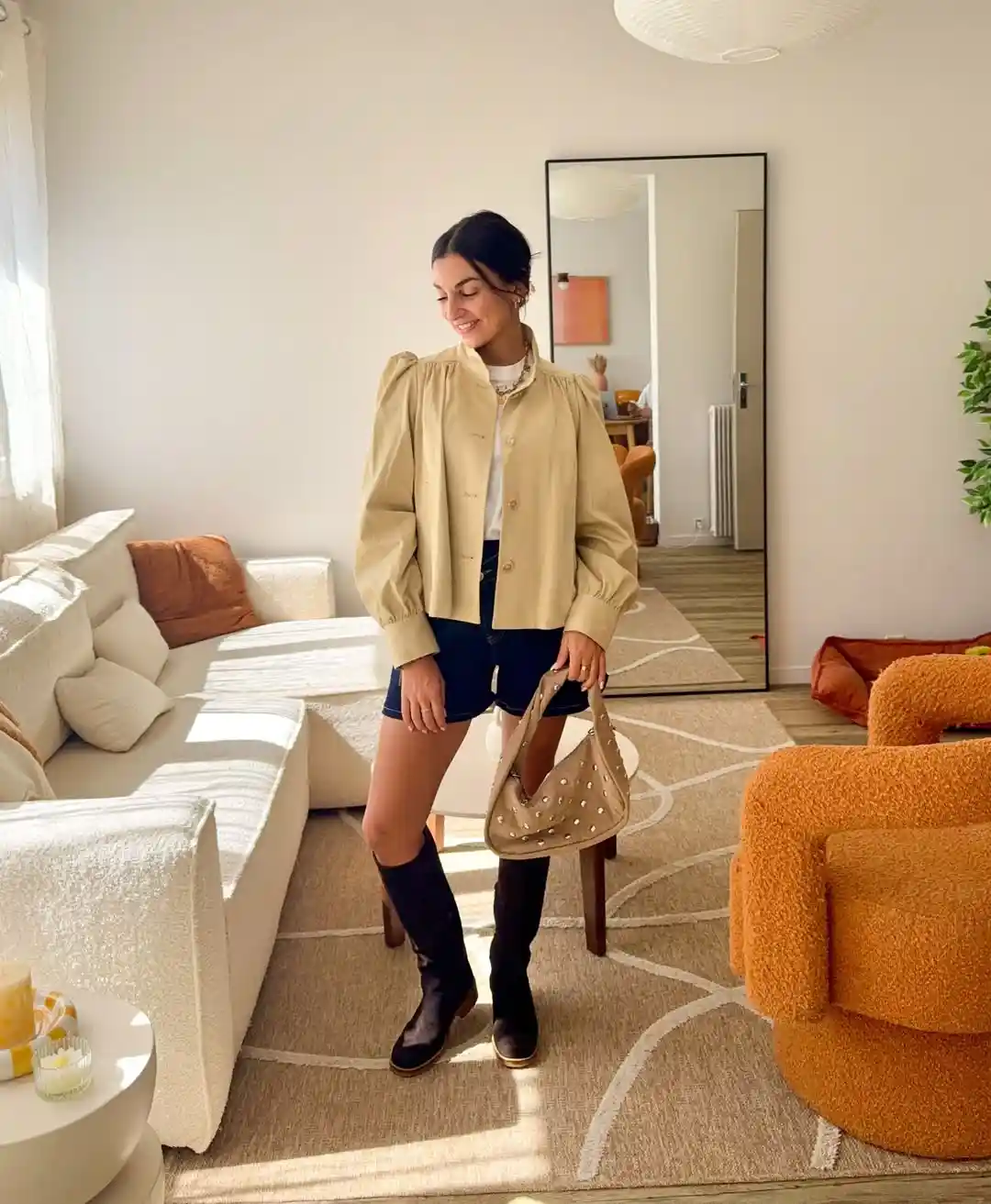 Puffed-sleeve beige jacket with shorts and knee-high boots
