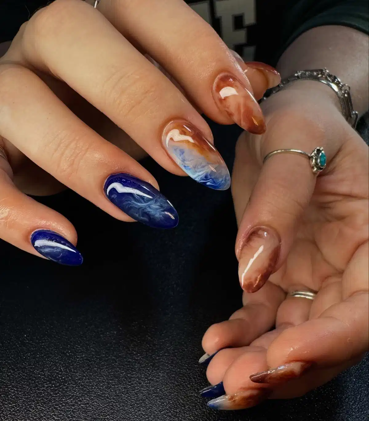 Marbled navy and brown with cloudy white-blue veining