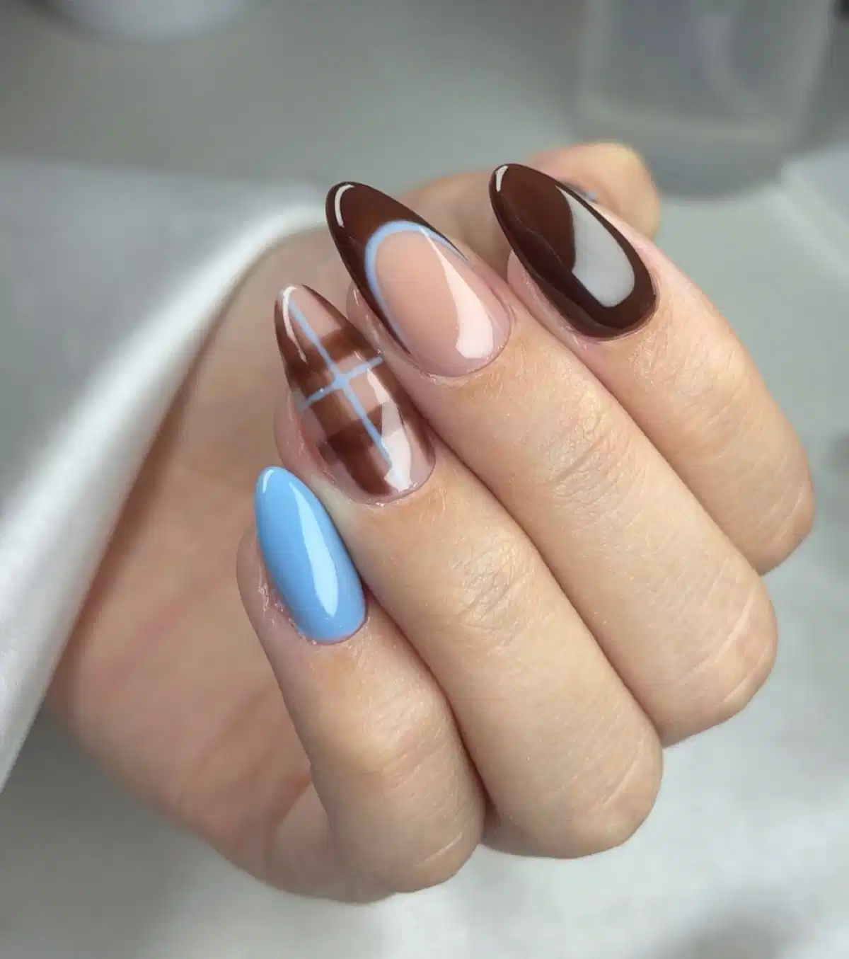 Light-blue accent lines with brown and negative space
