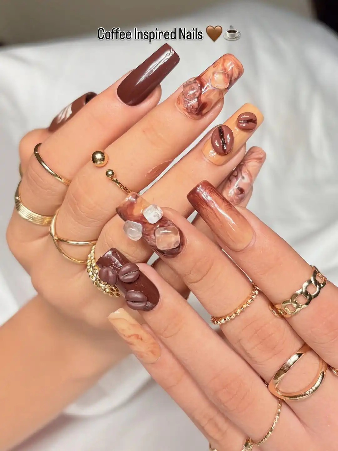 Brown coffee-inspired set with raised bean shapes and clear 3D cubes