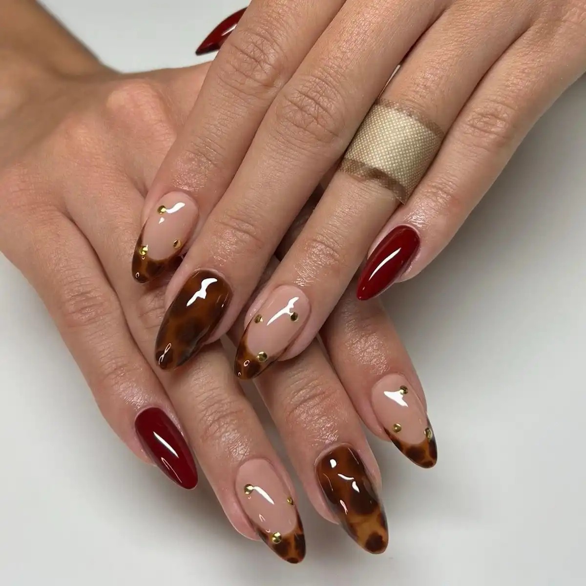 Nude with Brown Mottled Tips and Gold Studs