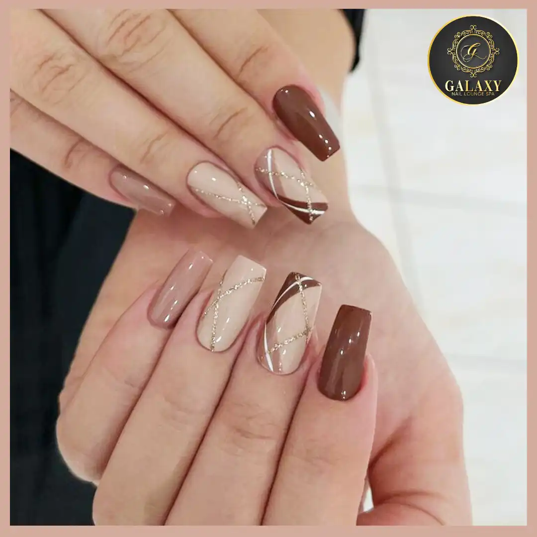 Glossy brown and beige squares with crisscross rhinestone-like lines