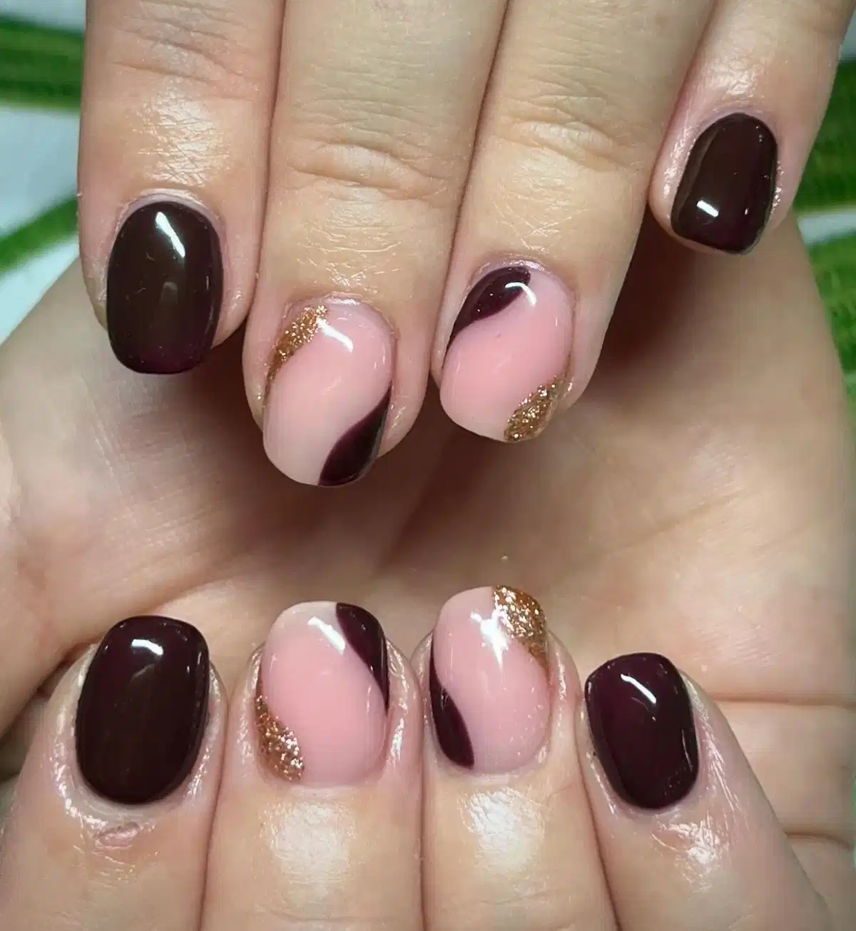 Deep brown and pink swoops with gold glitter accents