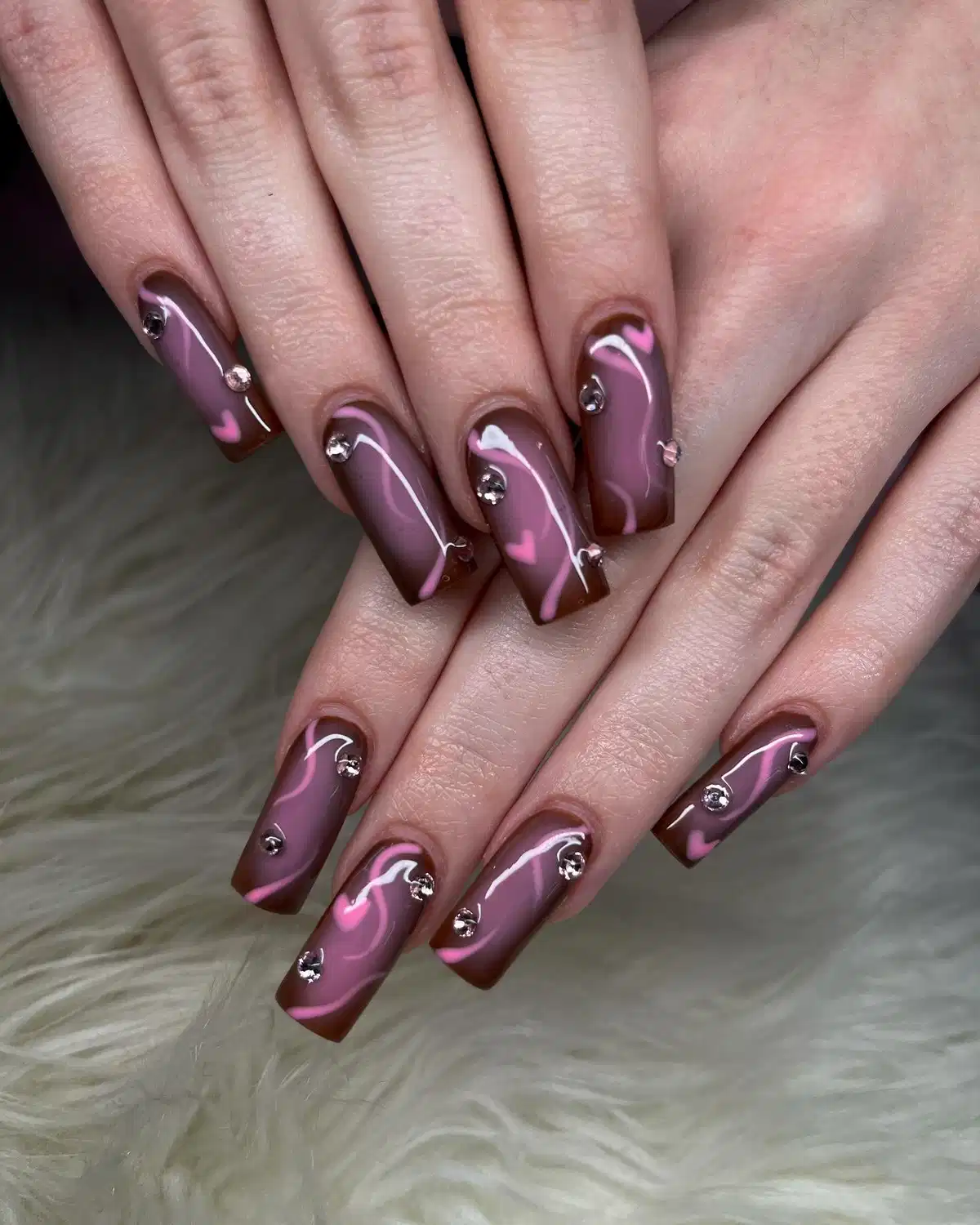 Mauve and brown swirls with pink hearts and gems