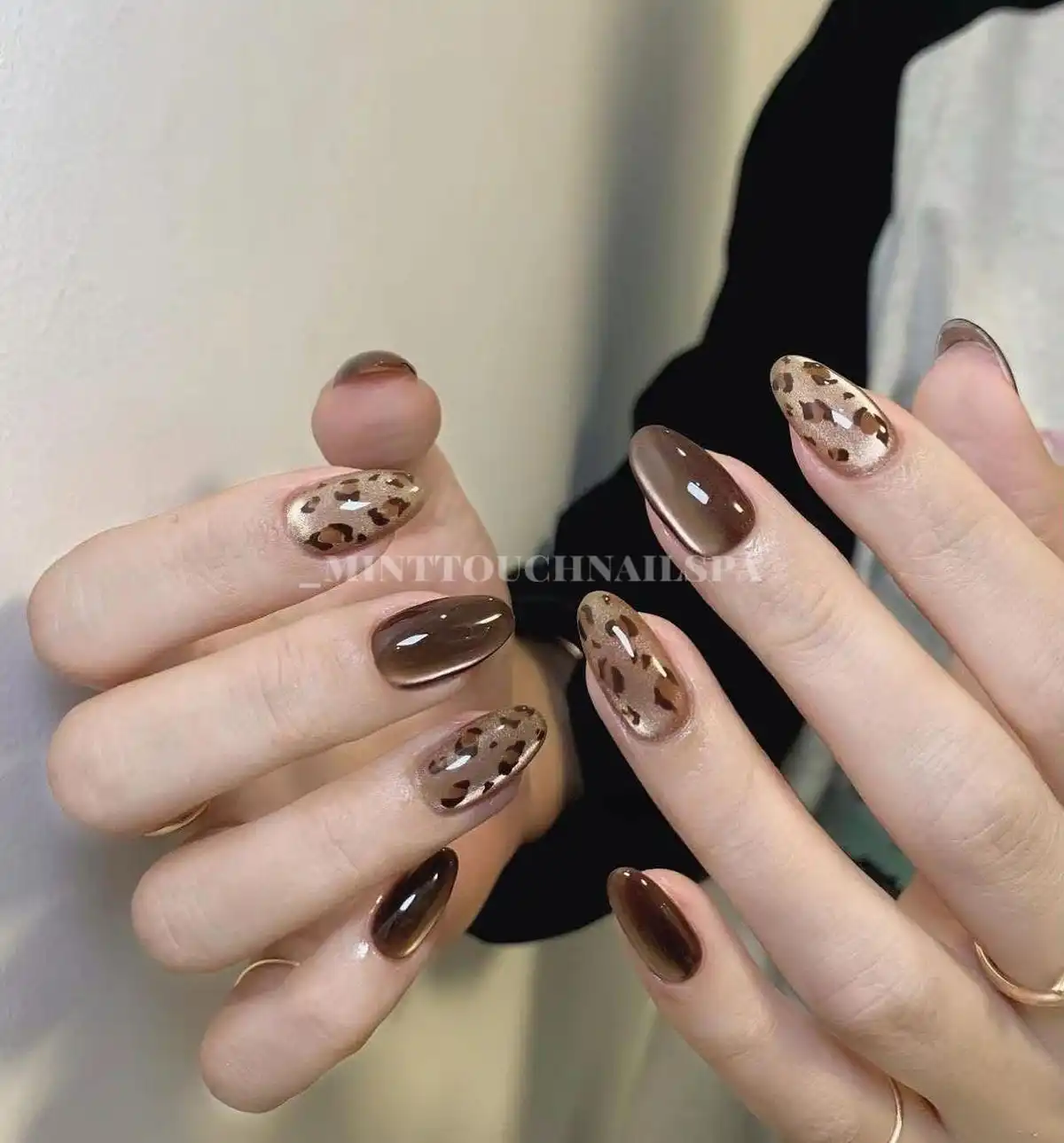 Glossy dark brown with metallic spotted accent nails