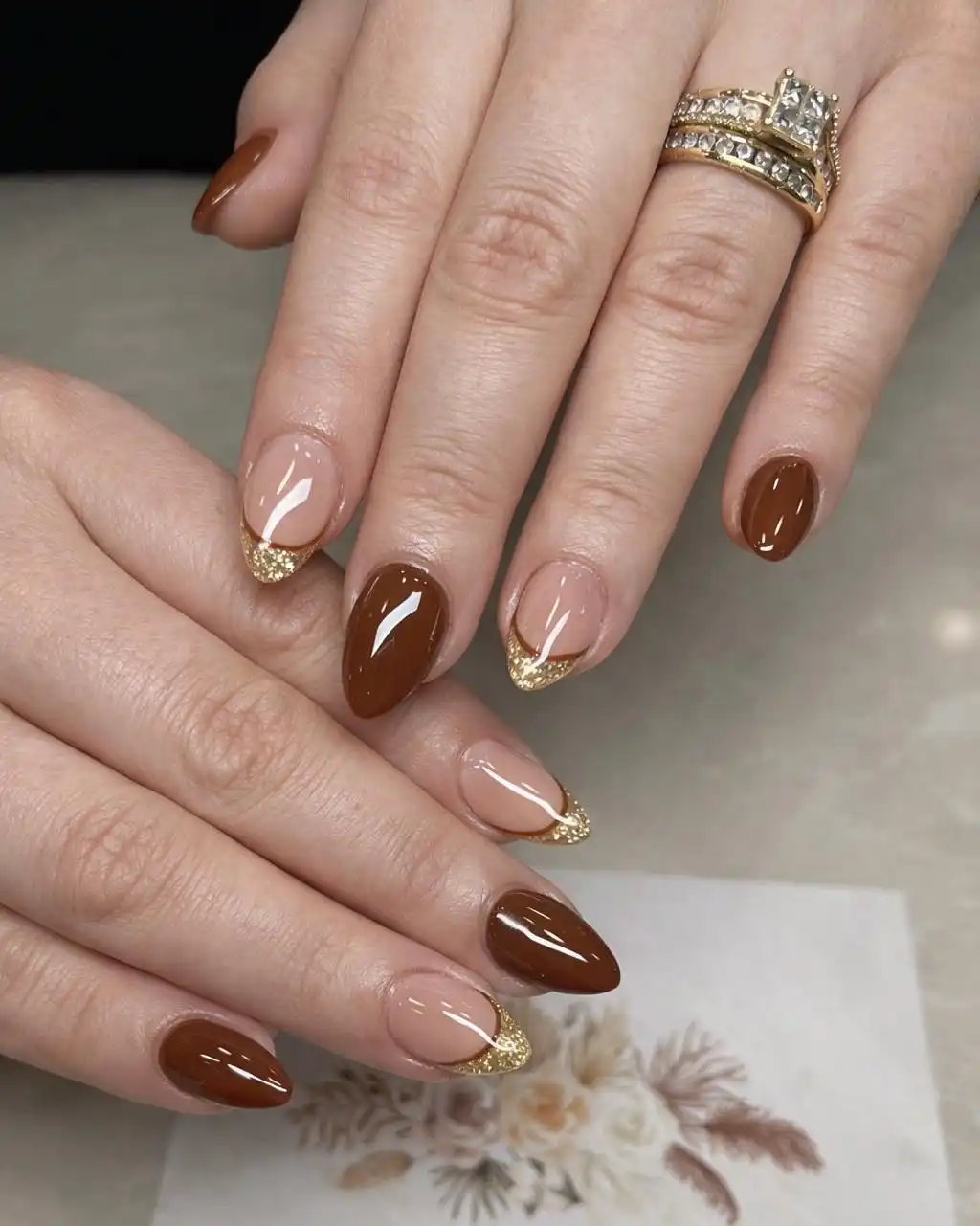 Solid Brown with Nude-and-Gold Glitter French Tips