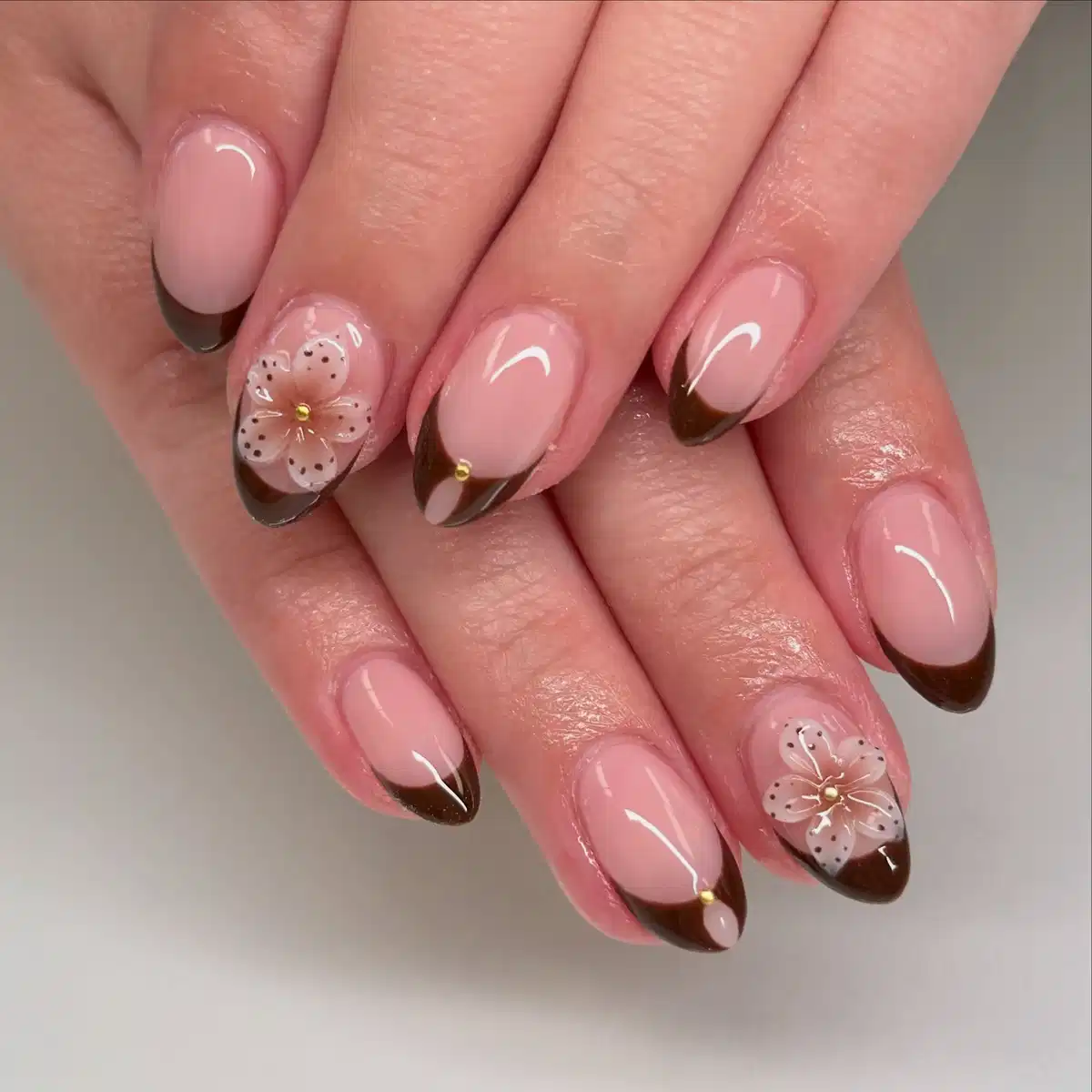 Angled Brown French Tips with Translucent Floral Overlays