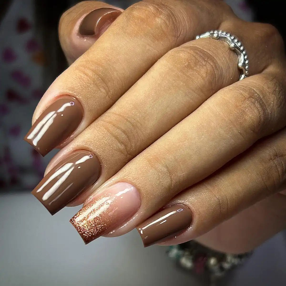 Glossy browns with a glitter ombre accent
