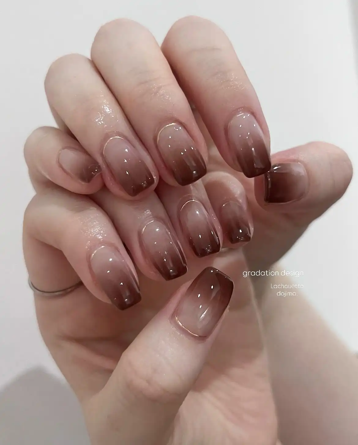 Subtle brown tip gradation on short nails