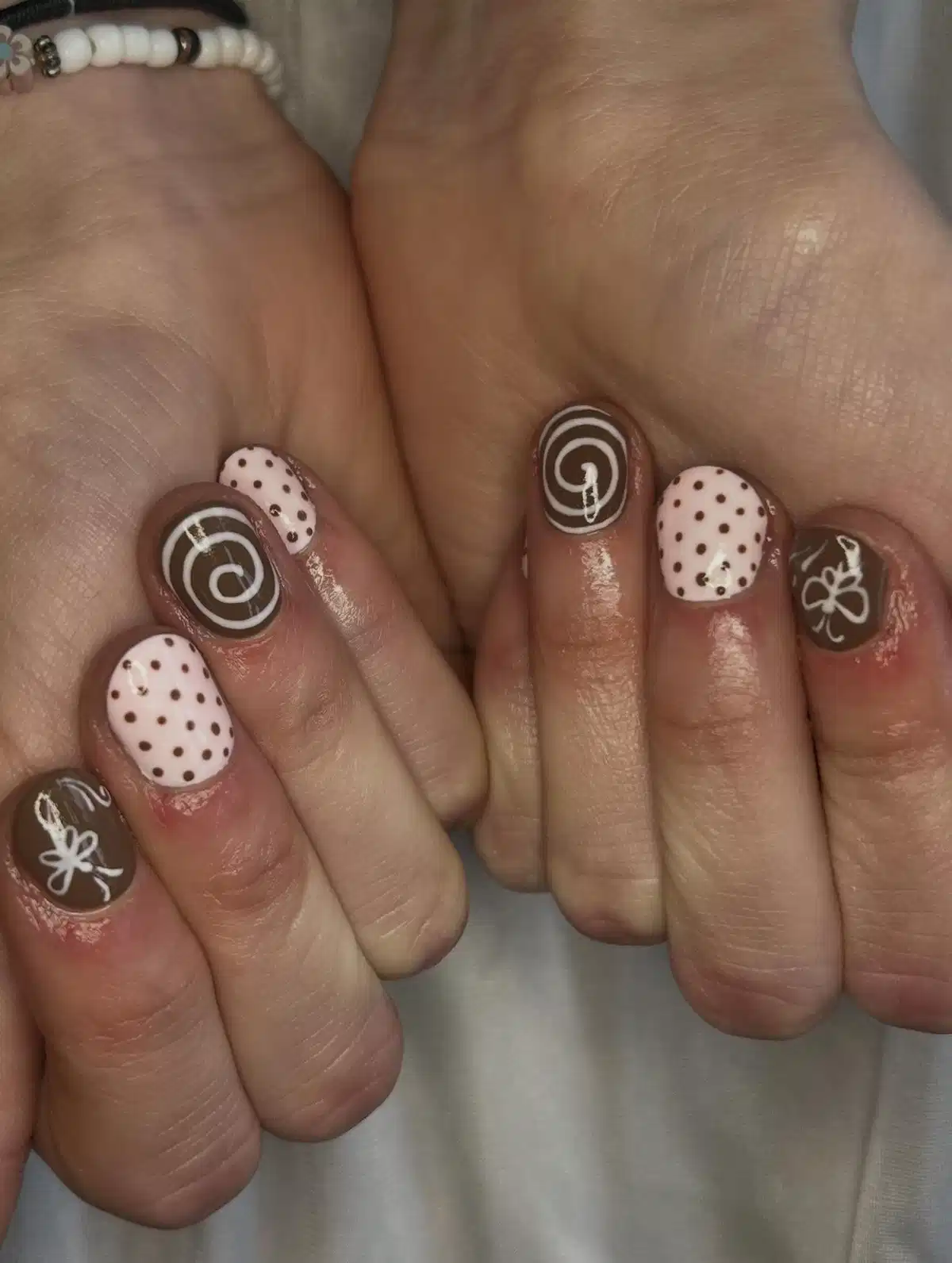 Brown-and-white set with spirals and polka dots