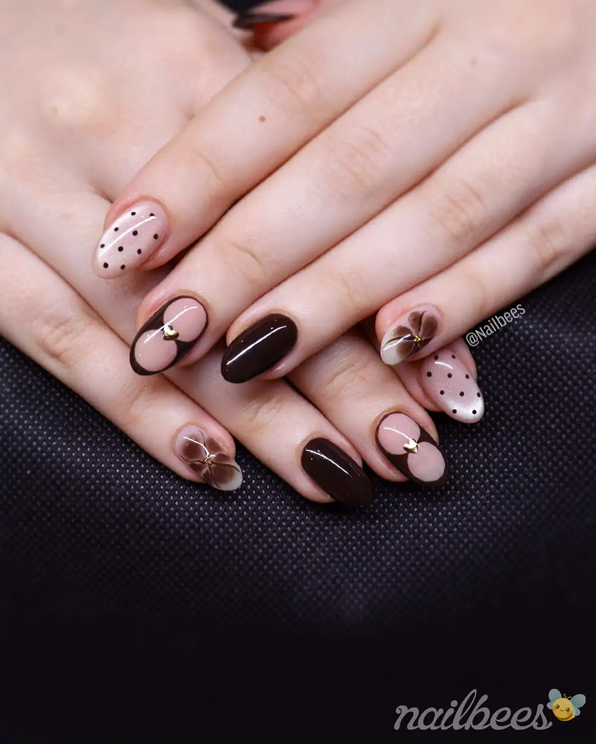 Dark chocolate solids with outlined nude accents, dots, and floral centers