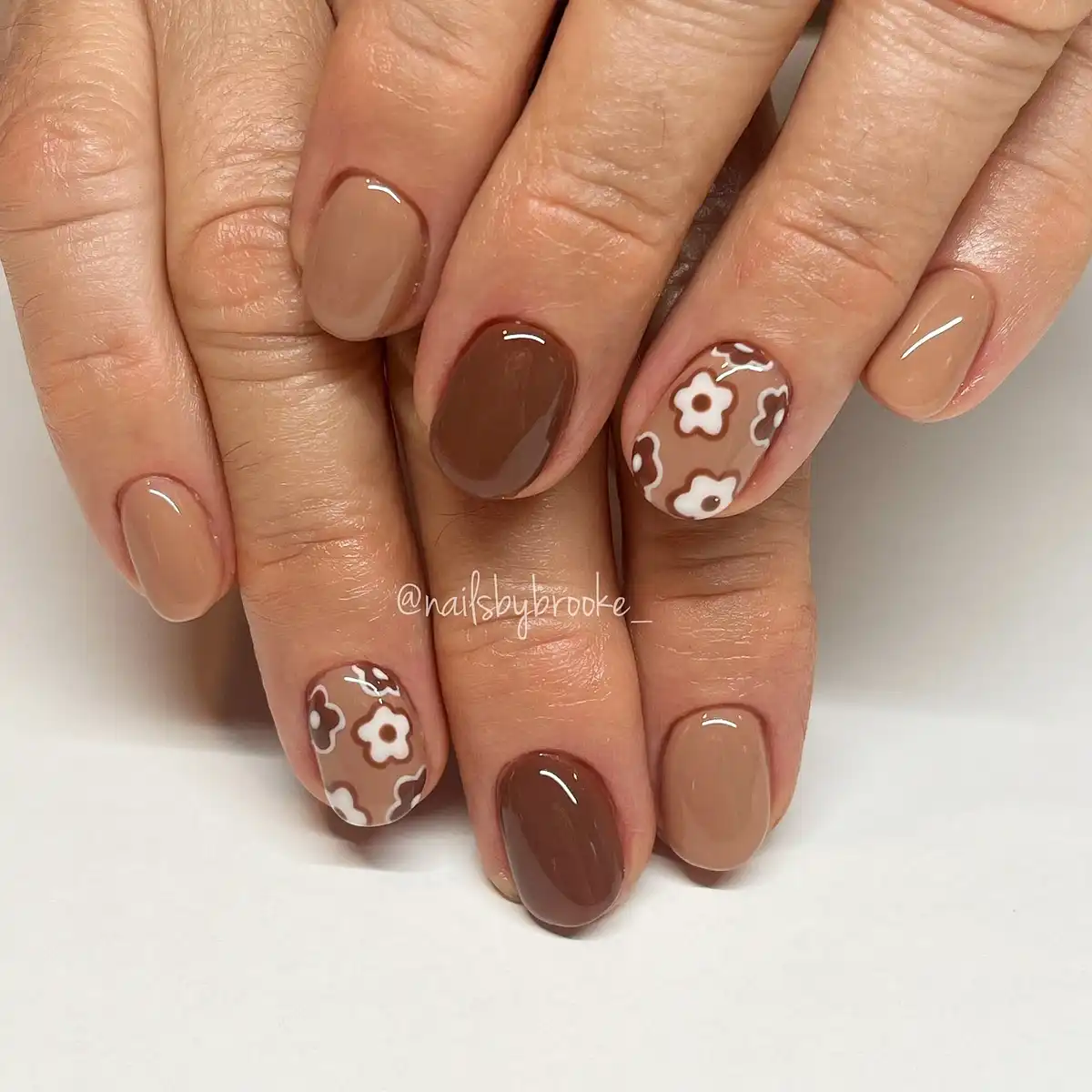 Glossy taupe and deep brown with white floral outlines
