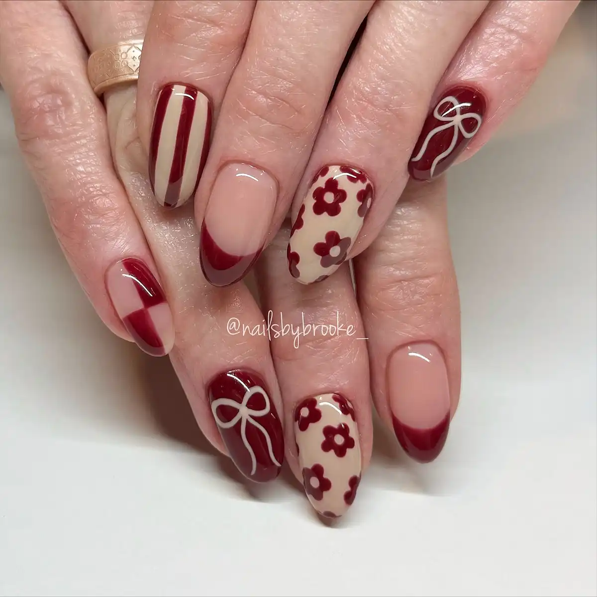 Nude-and-maroon graphic set with stripes, florals, and bow line art