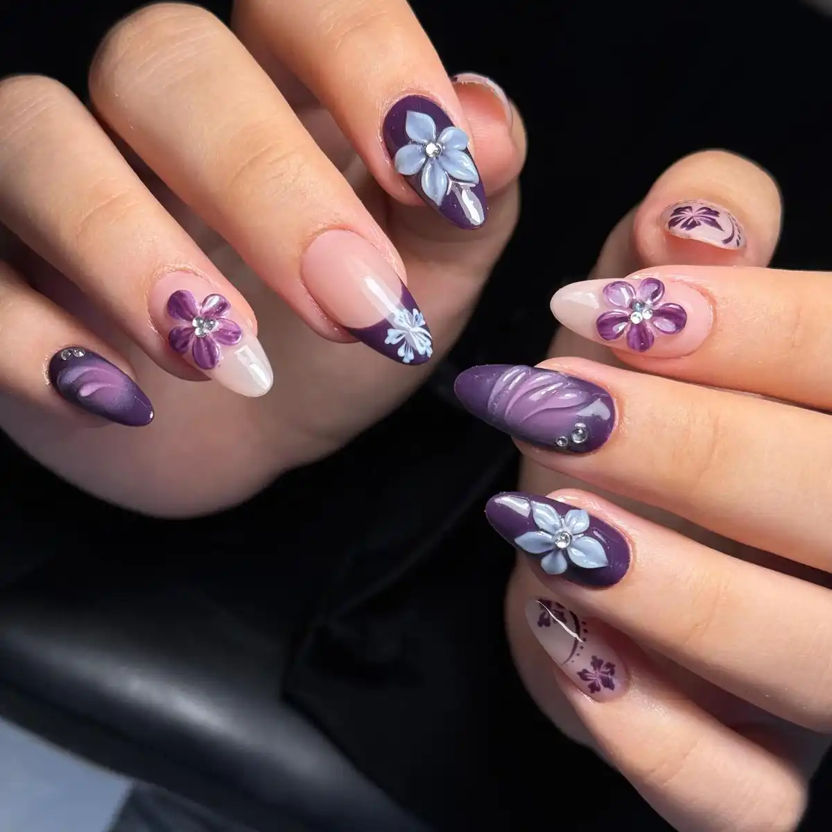 Purple-and-nude almonds with 3D floral appliqués and French-tip accents