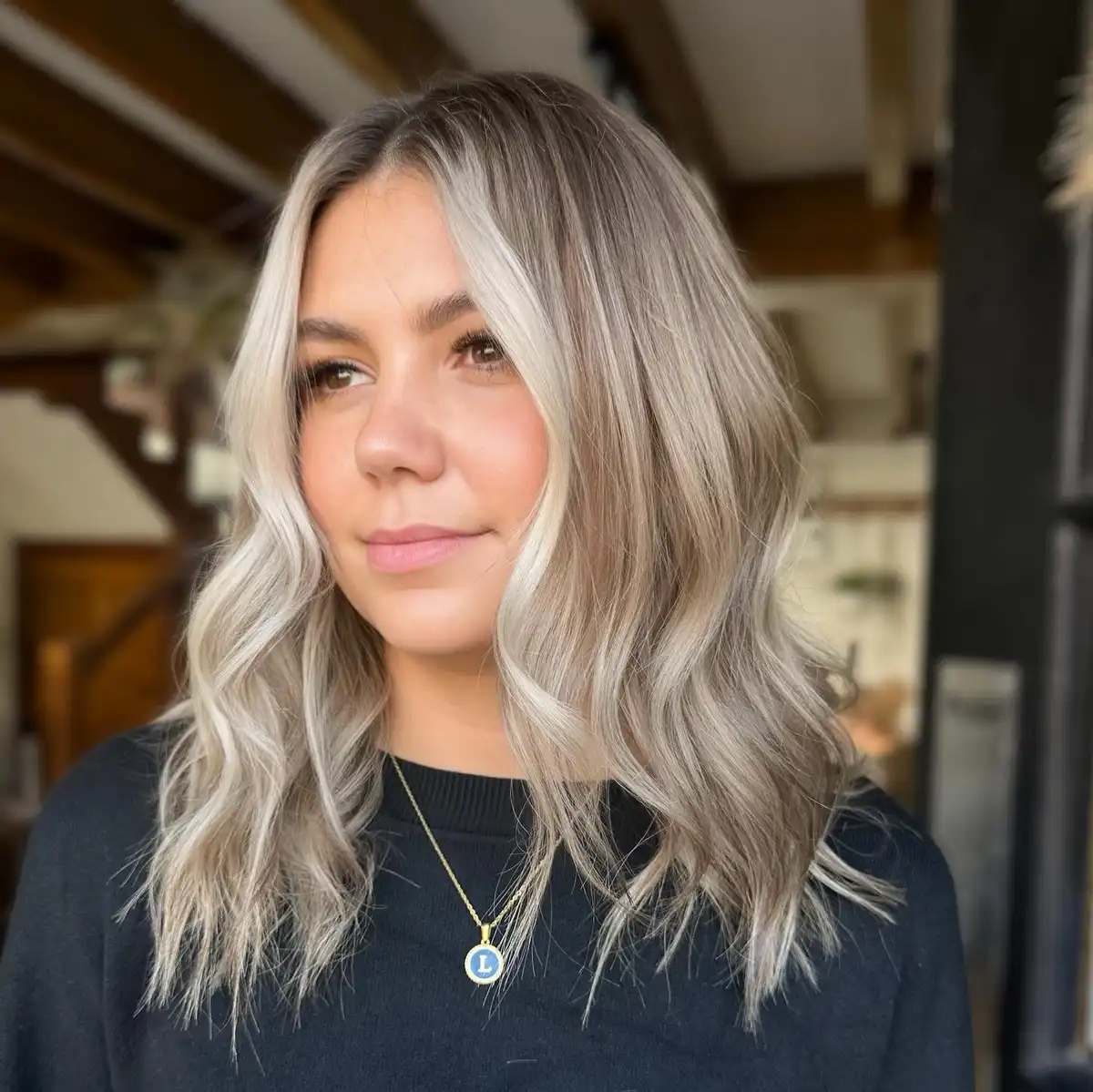 Cool-toned shoulder-length blonde with darker roots