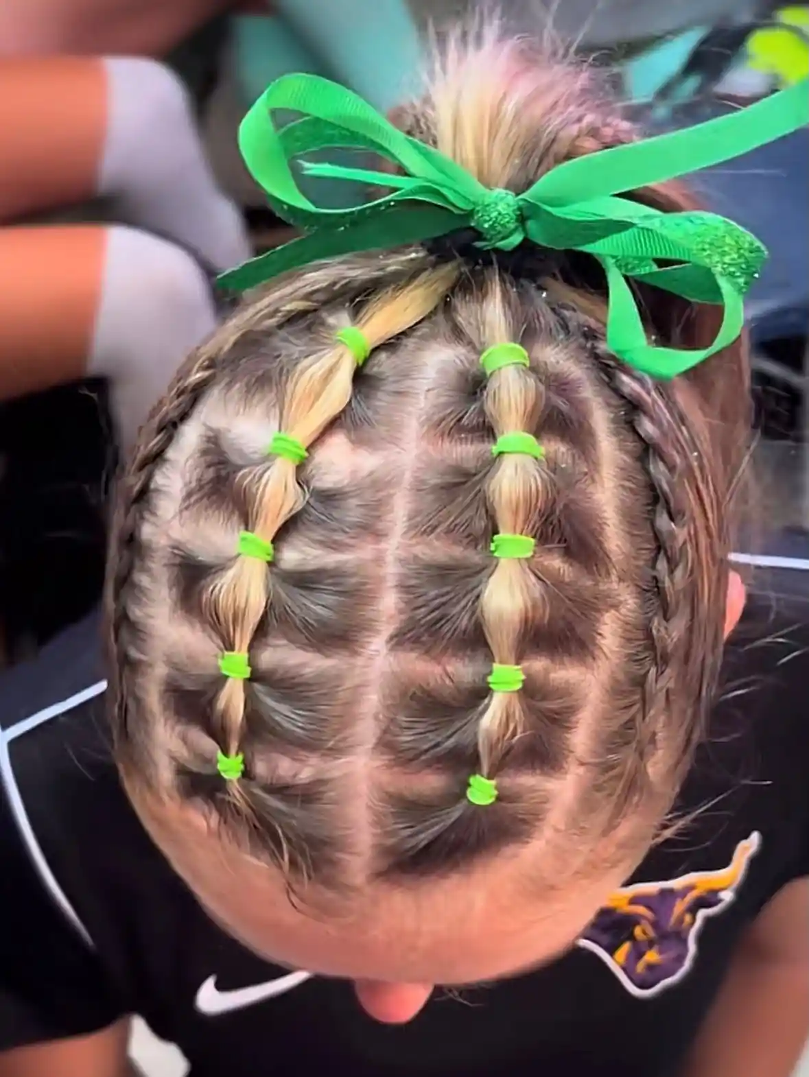 Neon green-tied bubble sections with side braids and bow