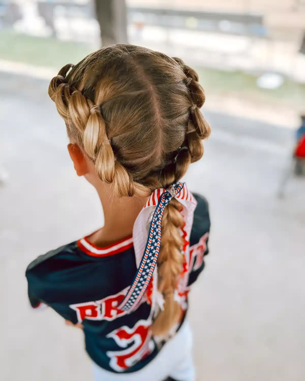 Center-part double braids into one braid with ribbon
