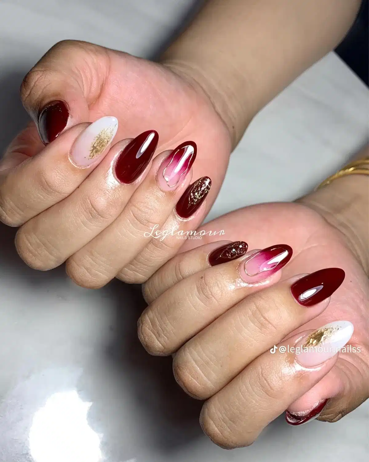 Maroon solids with pink swirl accents and gold flecks
