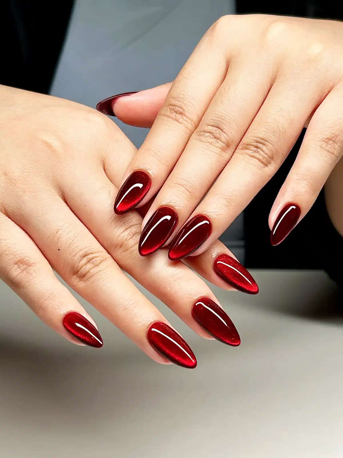 Classic deep red glossy cat-eye look