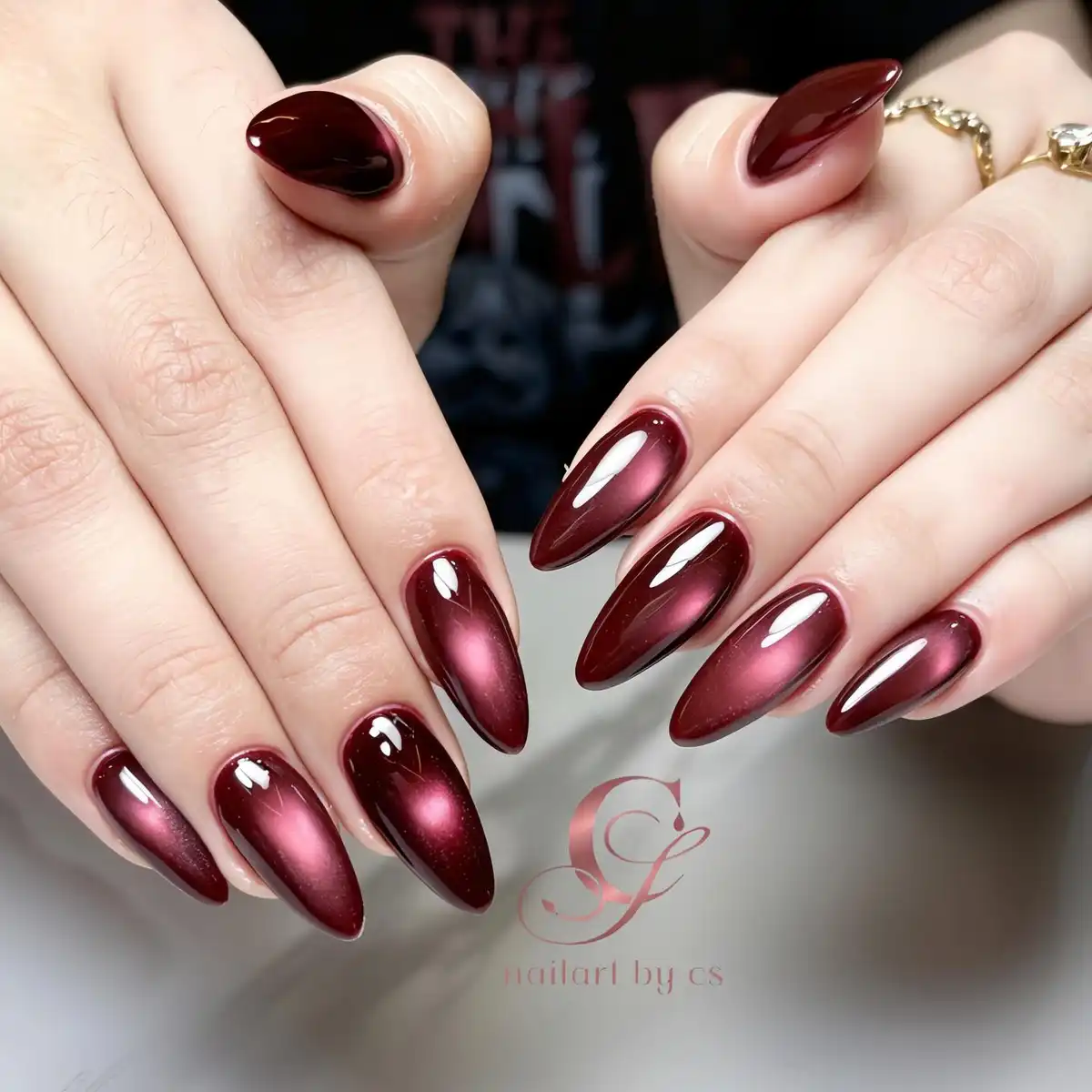 Long stiletto maroon cat-eye with pink glow