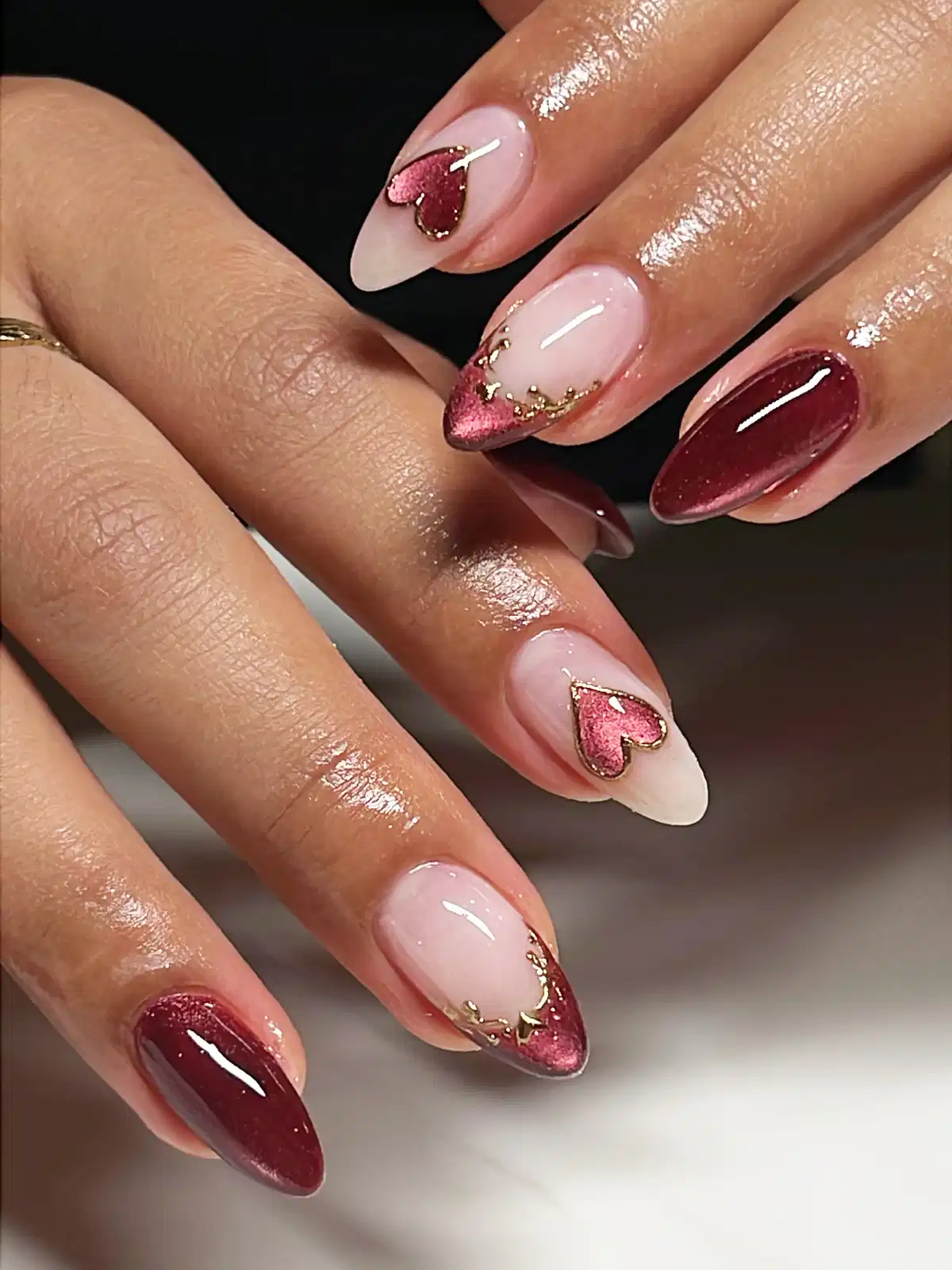 Nude base with maroon heart accents and gold outlines