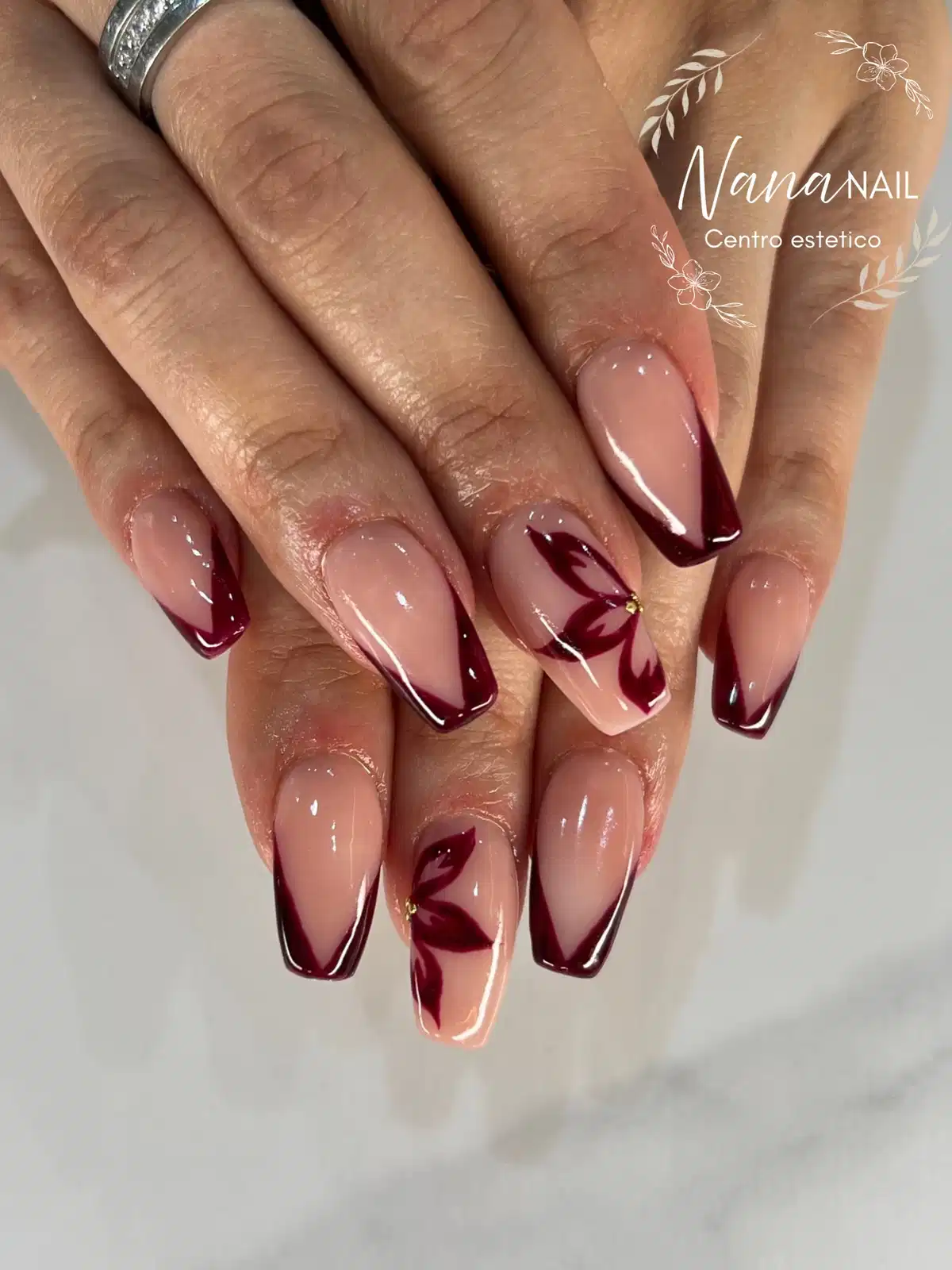 Deep Maroon French Tips with Floral Accent