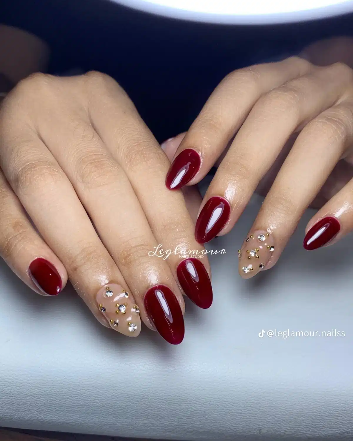 Maroon Almond Nails with Nude Rhinestone Accent Nails