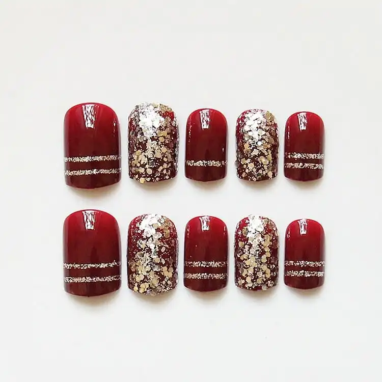Maroon Nail Tips with Glitter Stripes and Chunky Glitter Accents