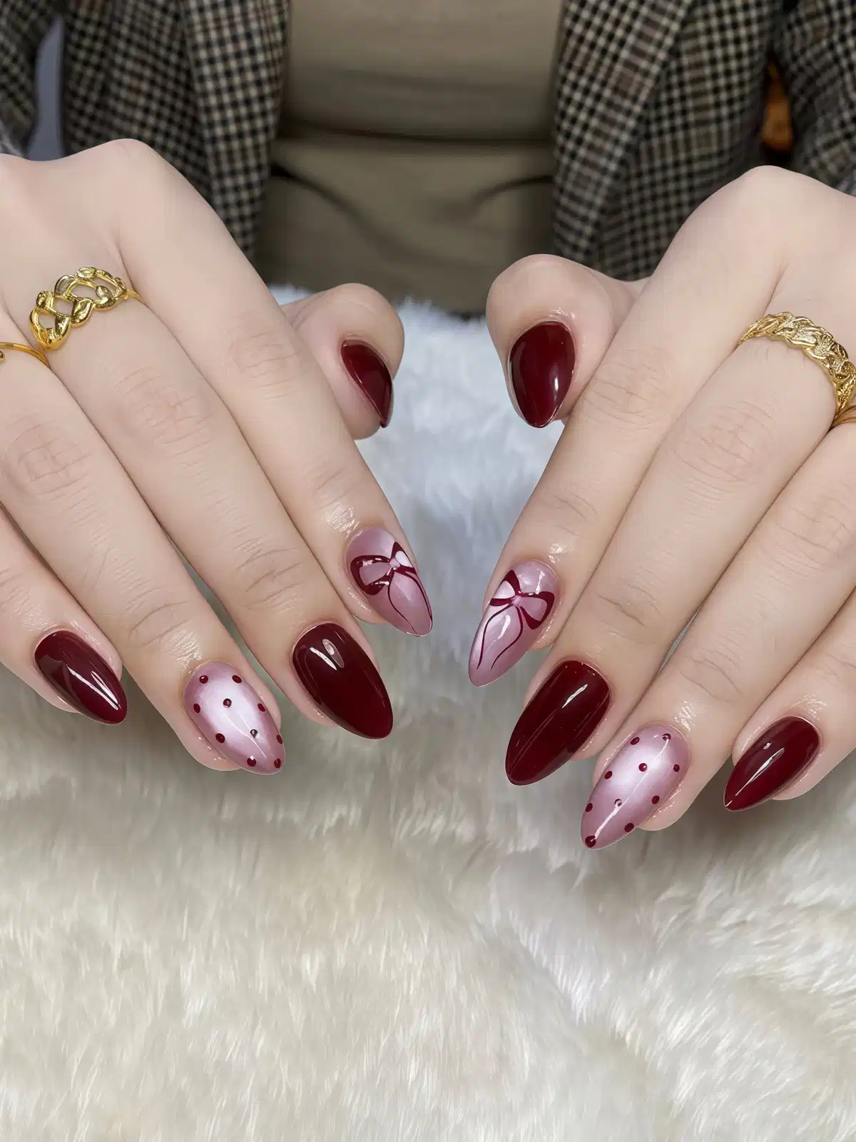 Maroon solids with pink polka-dot and ribbon accent nails