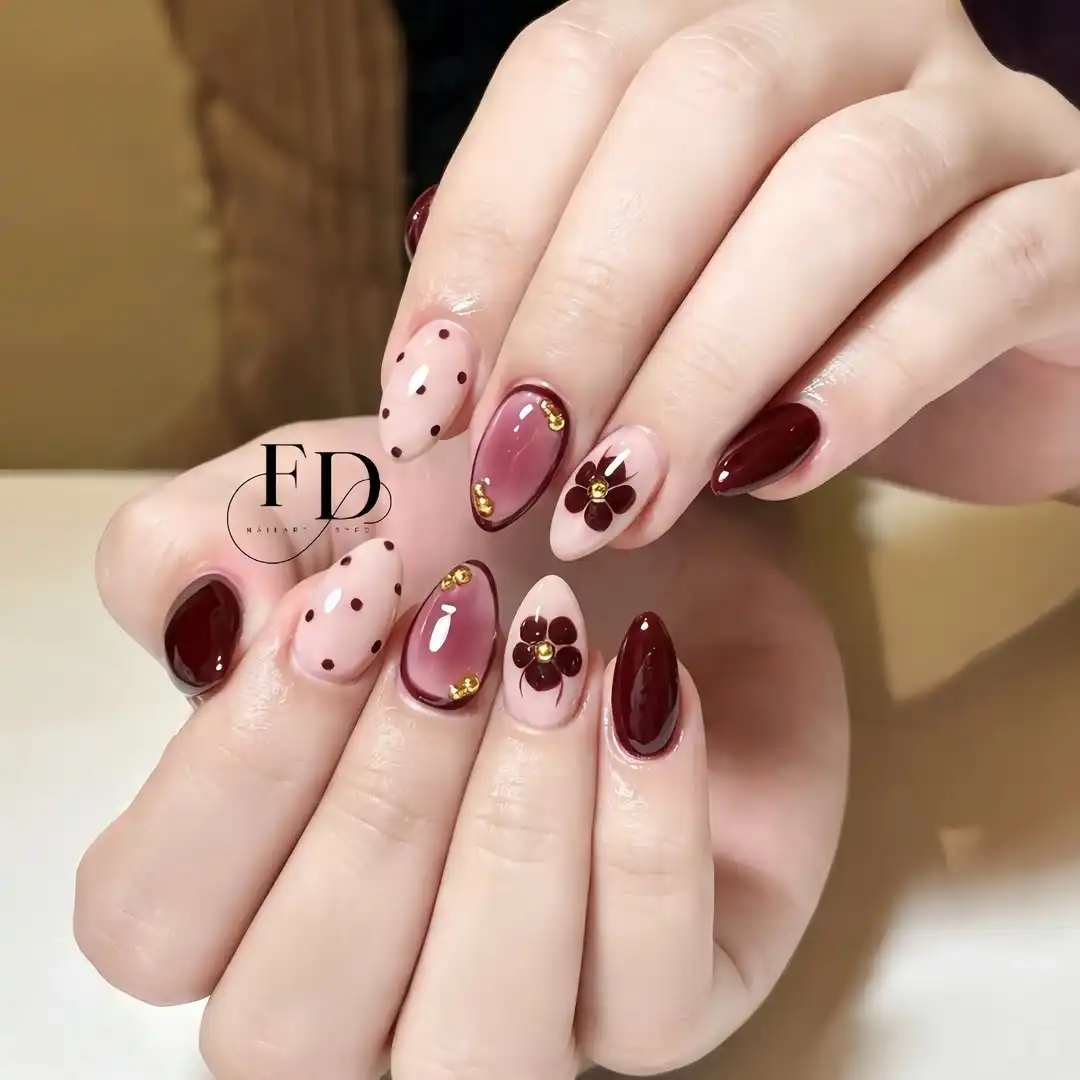 Mixed maroon accents: dots, flowers, and gold details