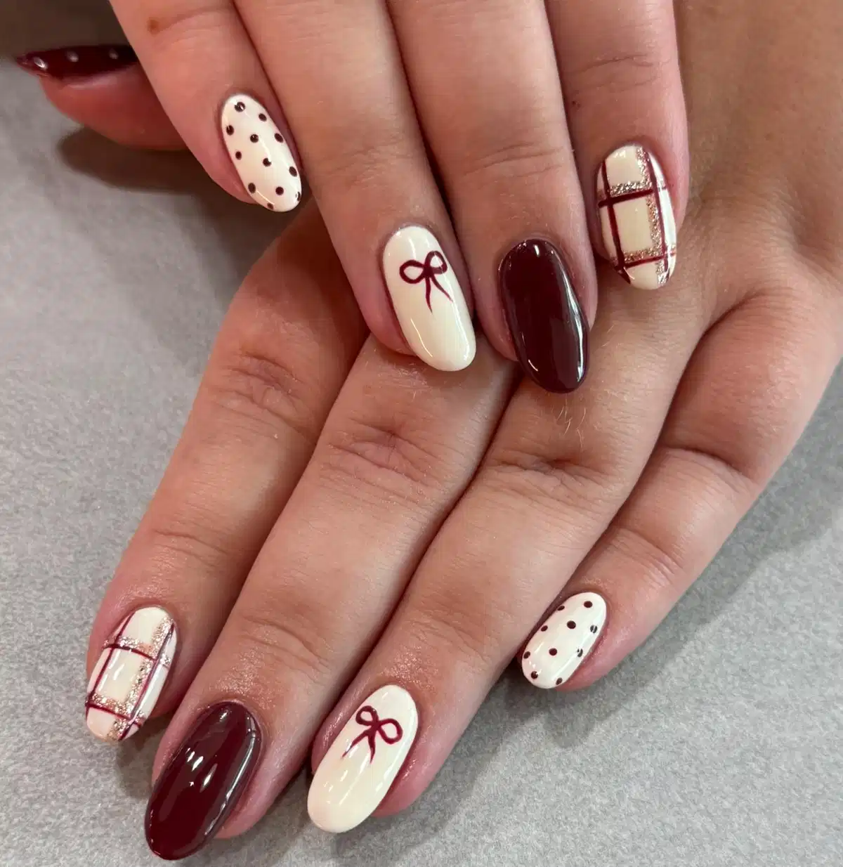 Cream and maroon mix: polka dots, bow outline, and grid accent