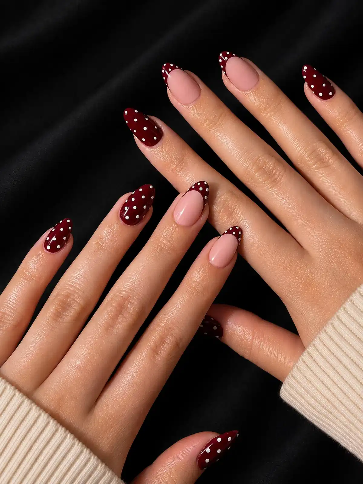 Maroon polka-dot French tips and full polka-dot maroon nails