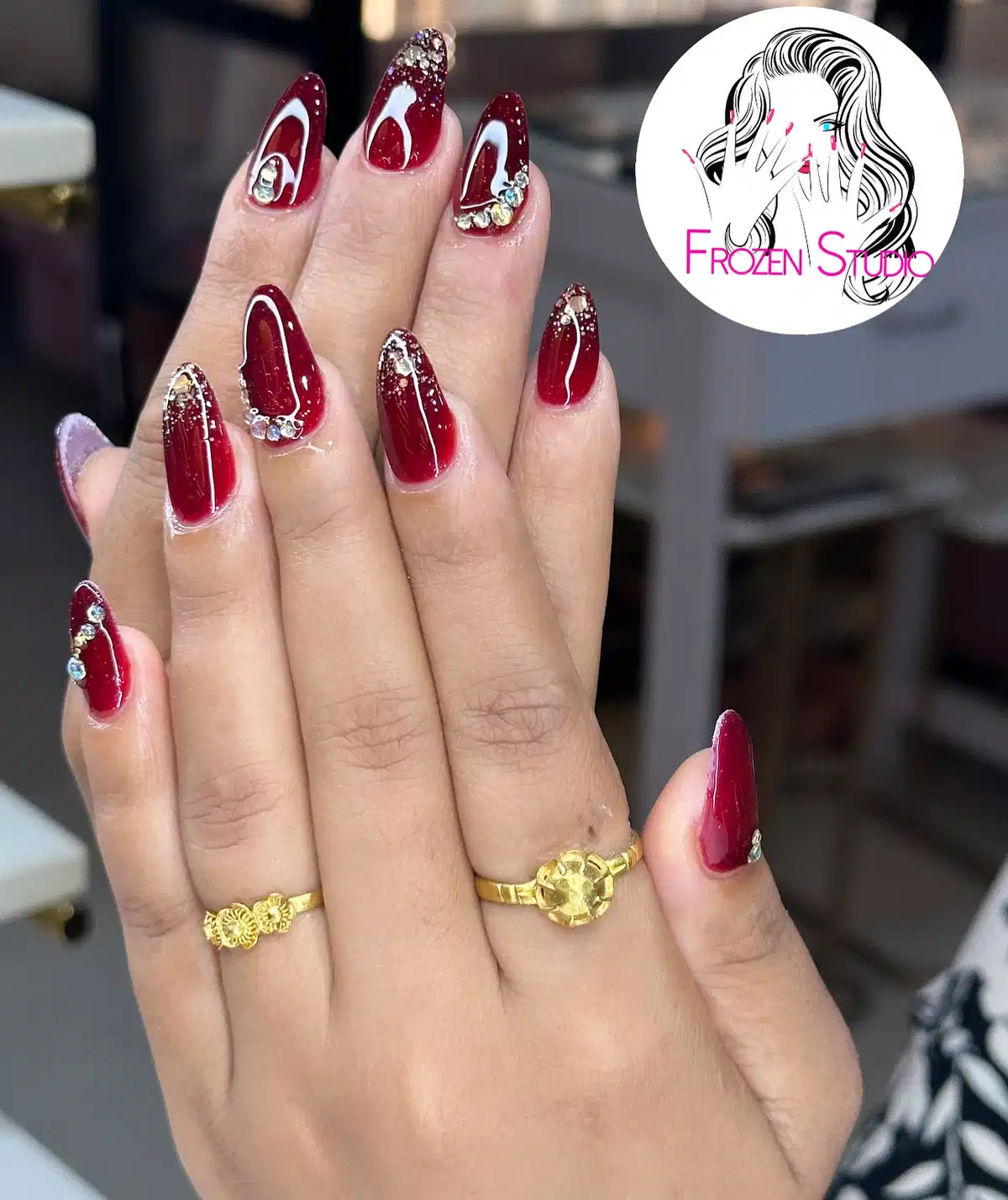 Glossy maroon with glitter gradients and rhinestone accents