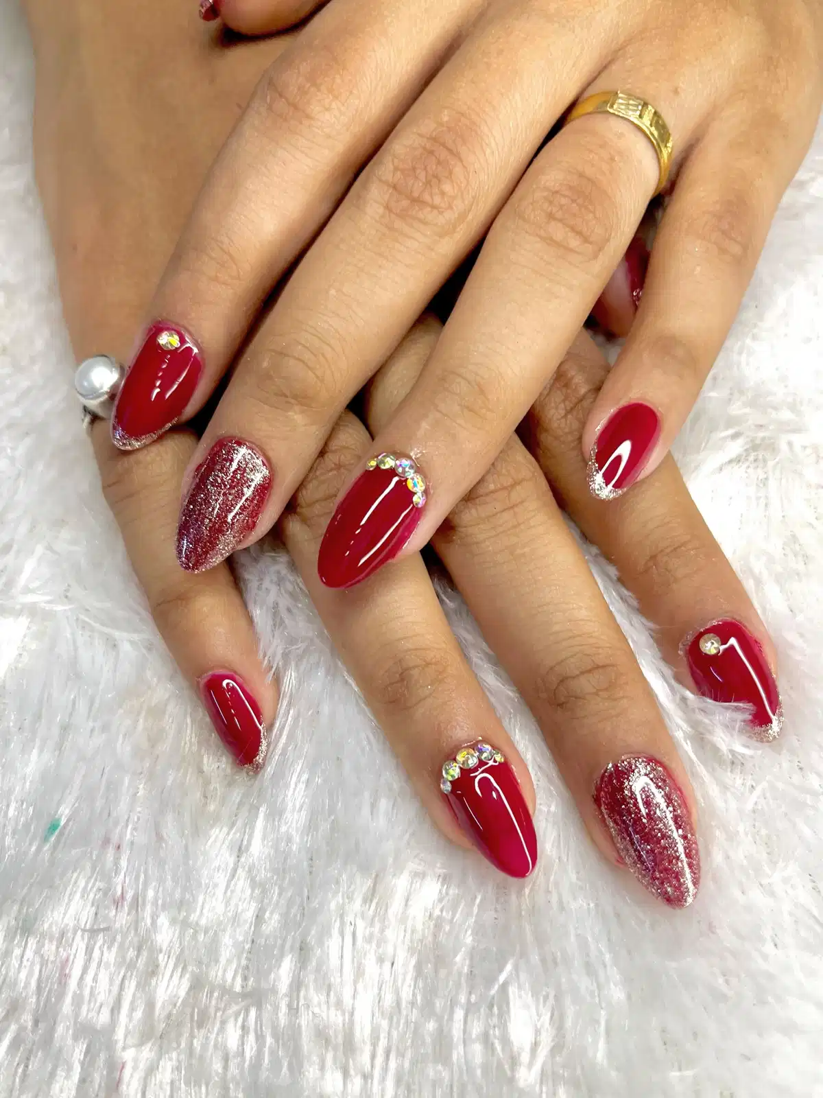 Glossy maroon with silver glitter tips and rhinestones