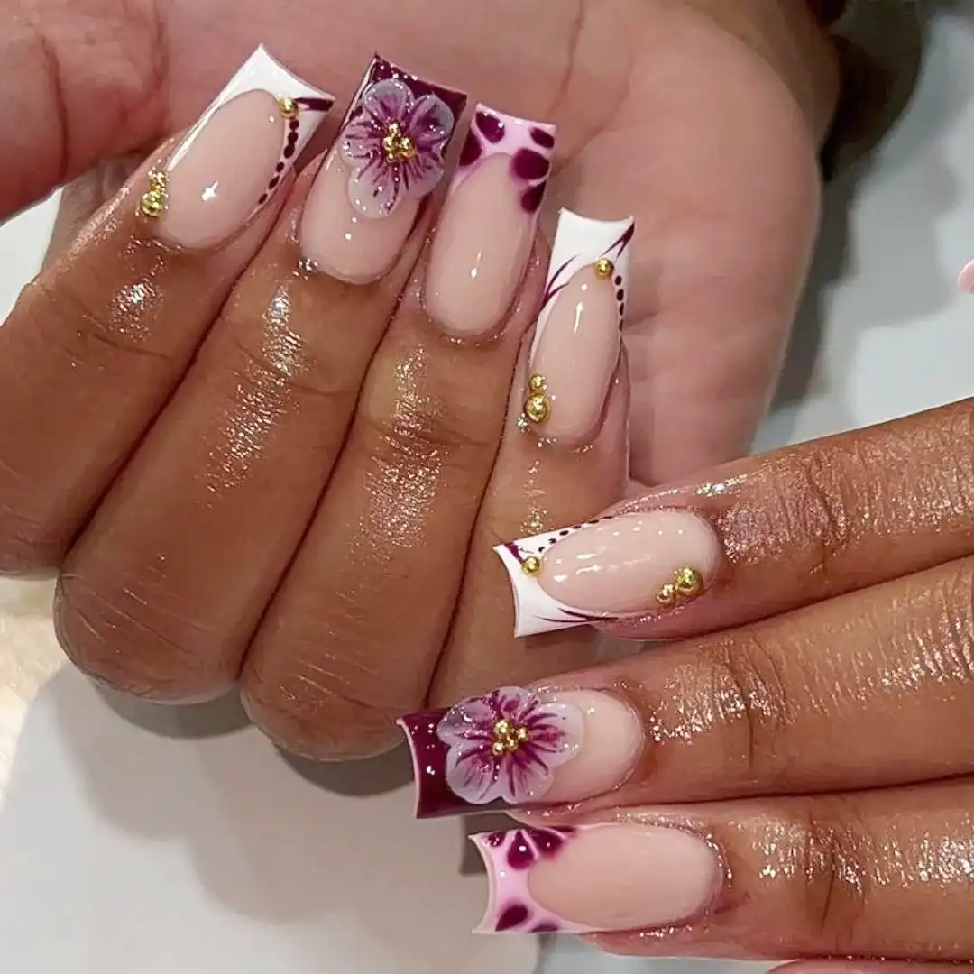 French tips with purple accents and 3D flowers
