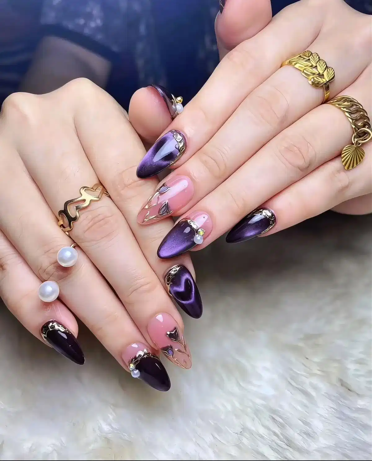 Stiletto purple with nude accents, gold lines, and pearl-like details