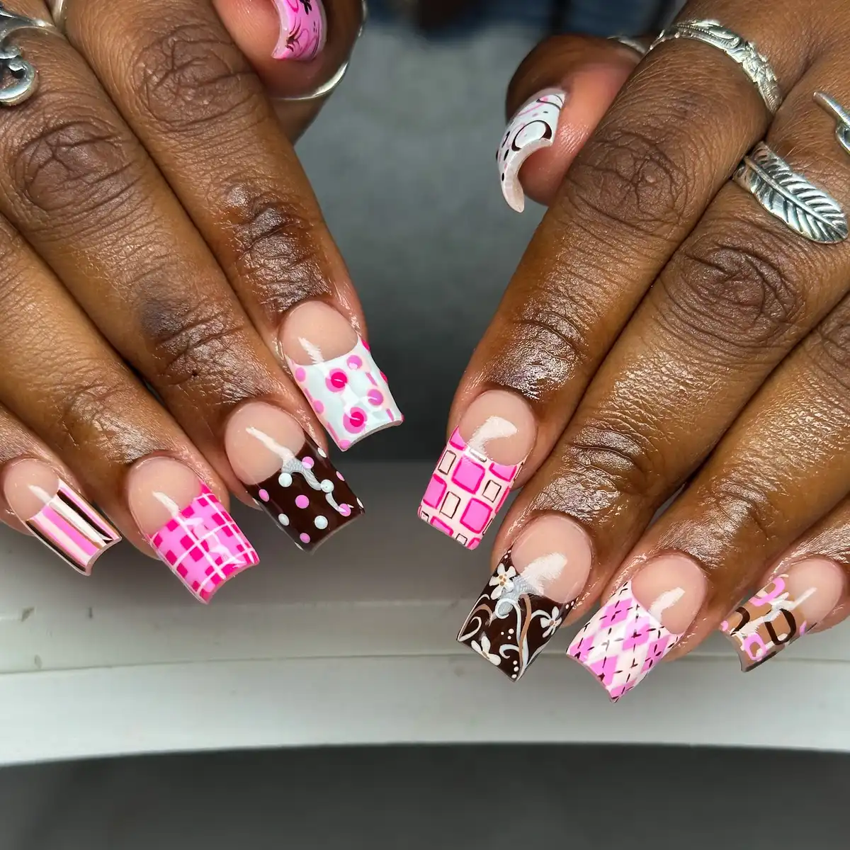 Mixed pink-and-brown patterned tips on a nude base