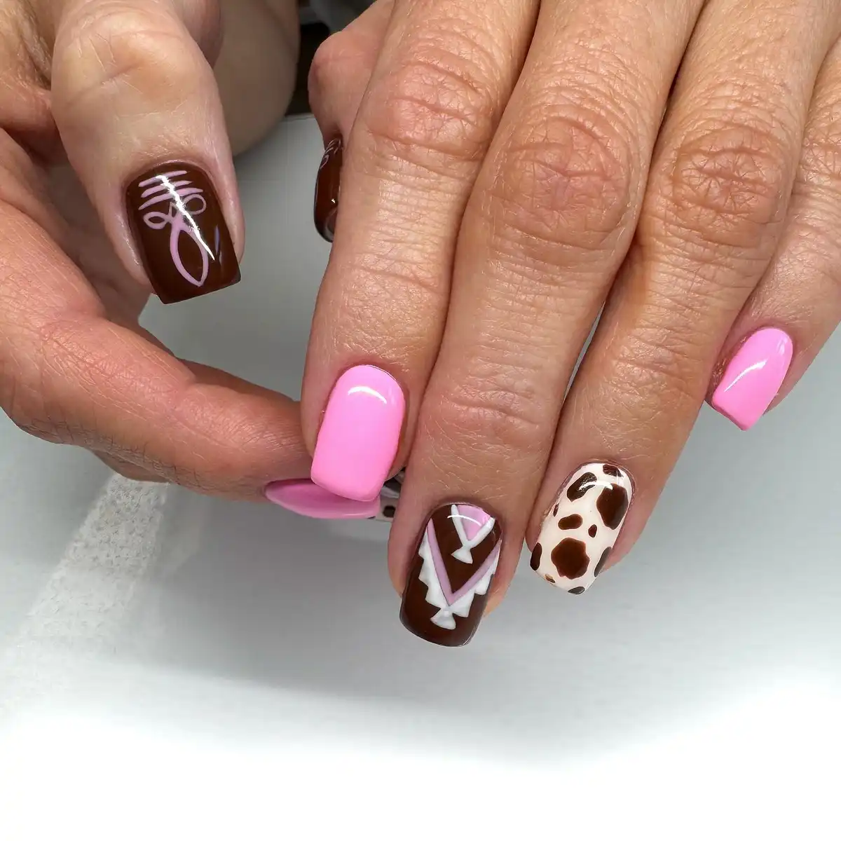 Pink solids with brown-and-white graphic accents